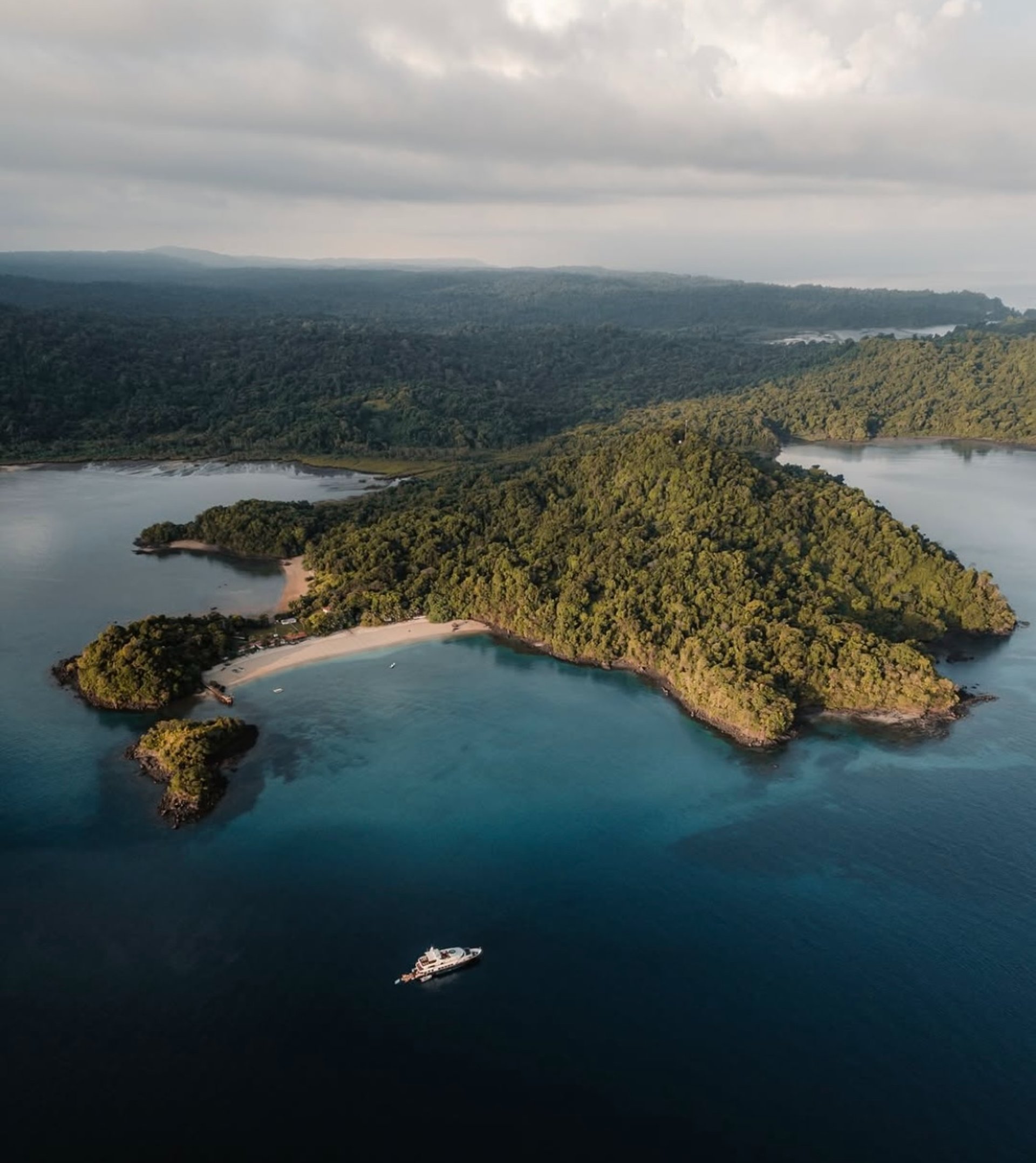 woman wearing yellow long-sleeved dress under white clouds and blue sky during daytime