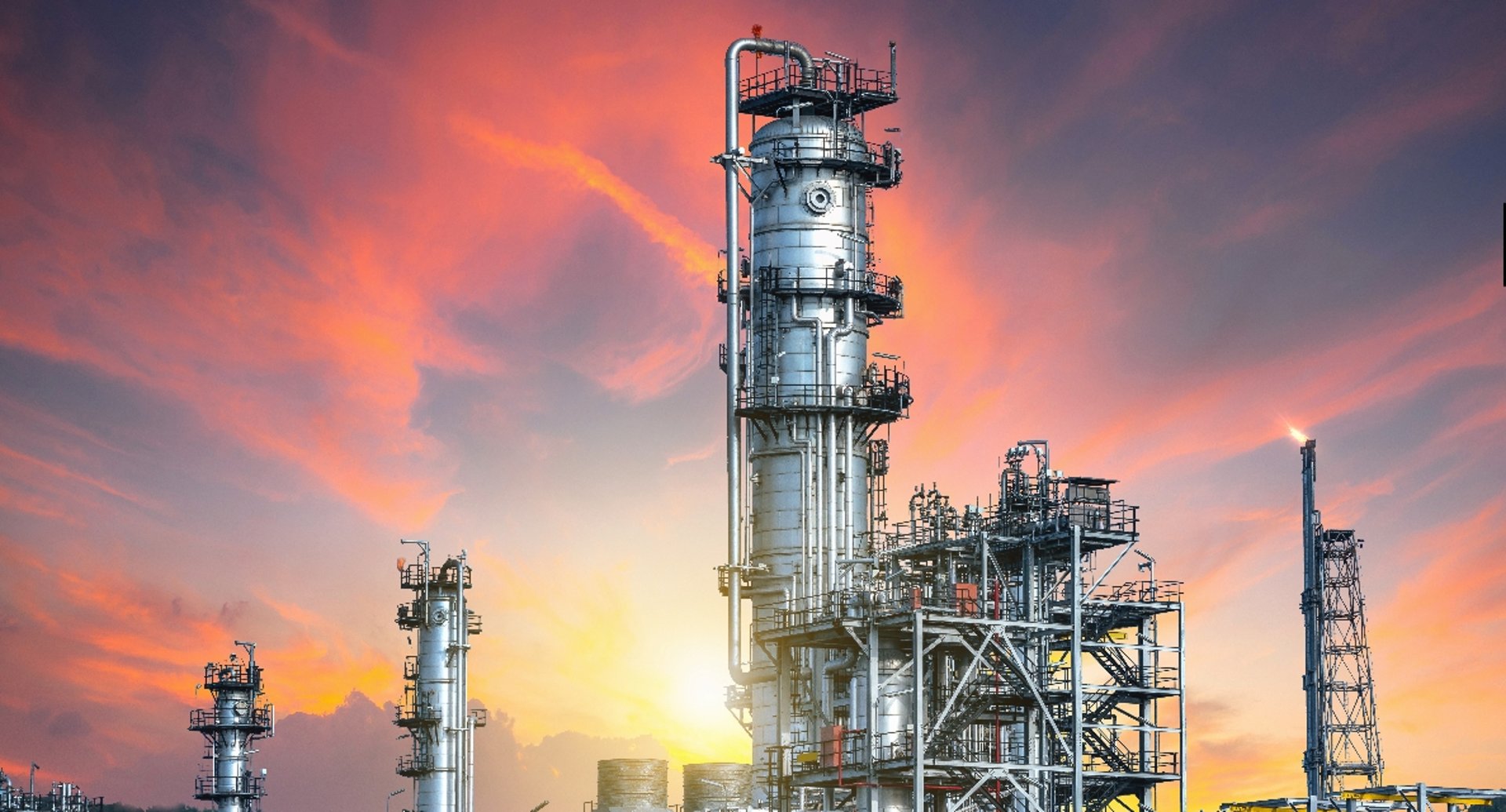 an abstract photo of a curved building with a blue sky in the background