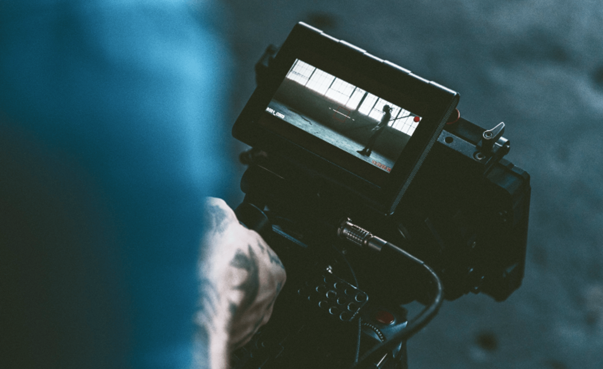 an abstract photo of a curved building with a blue sky in the background