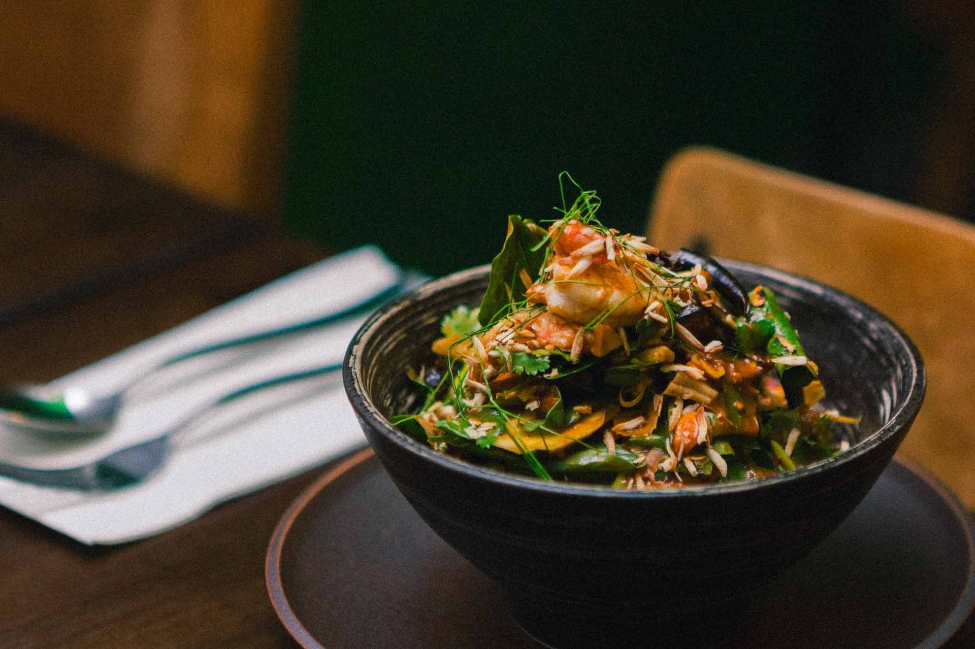 an abstract photo of a curved building with a blue sky in the background