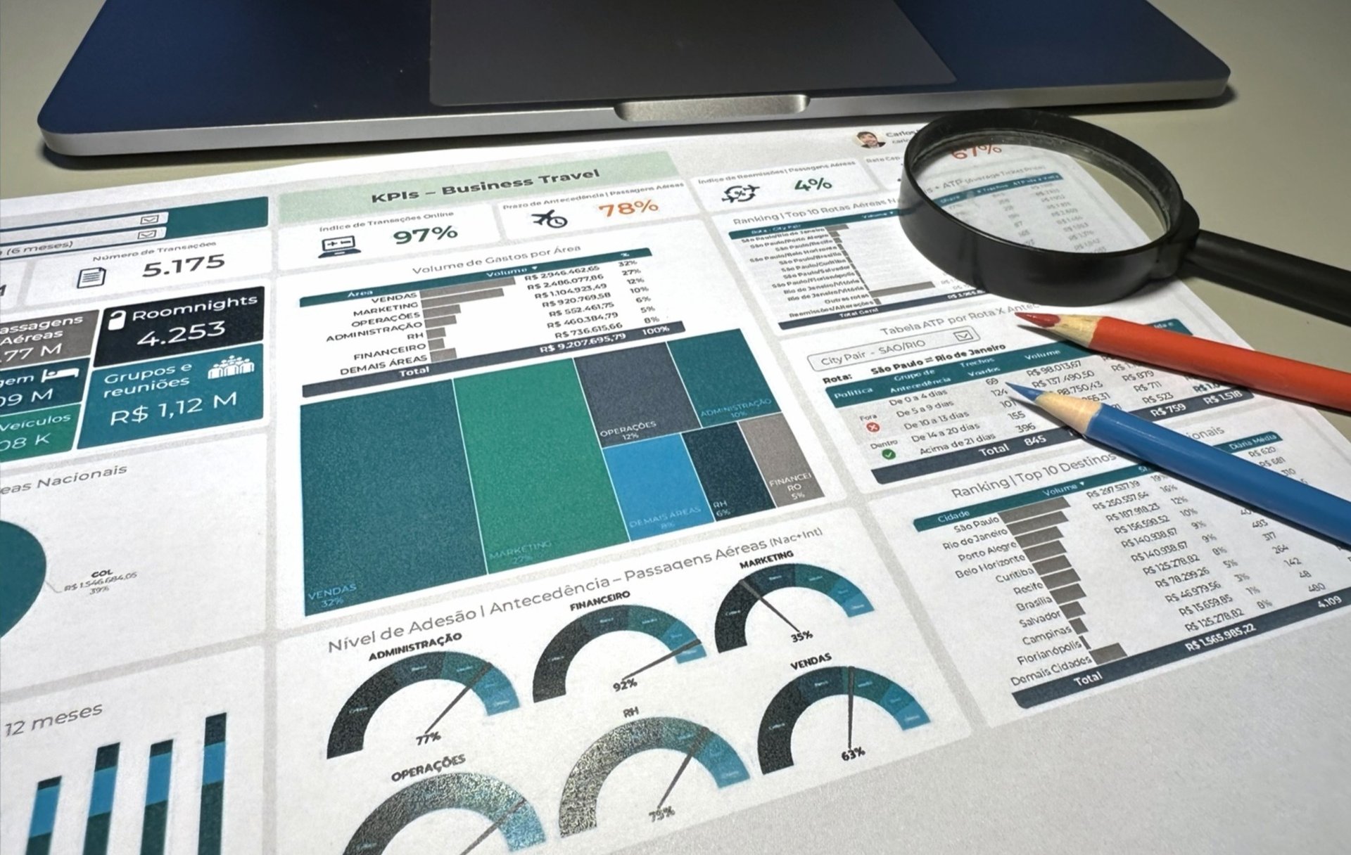 a person holding a piece of paper over a laptop