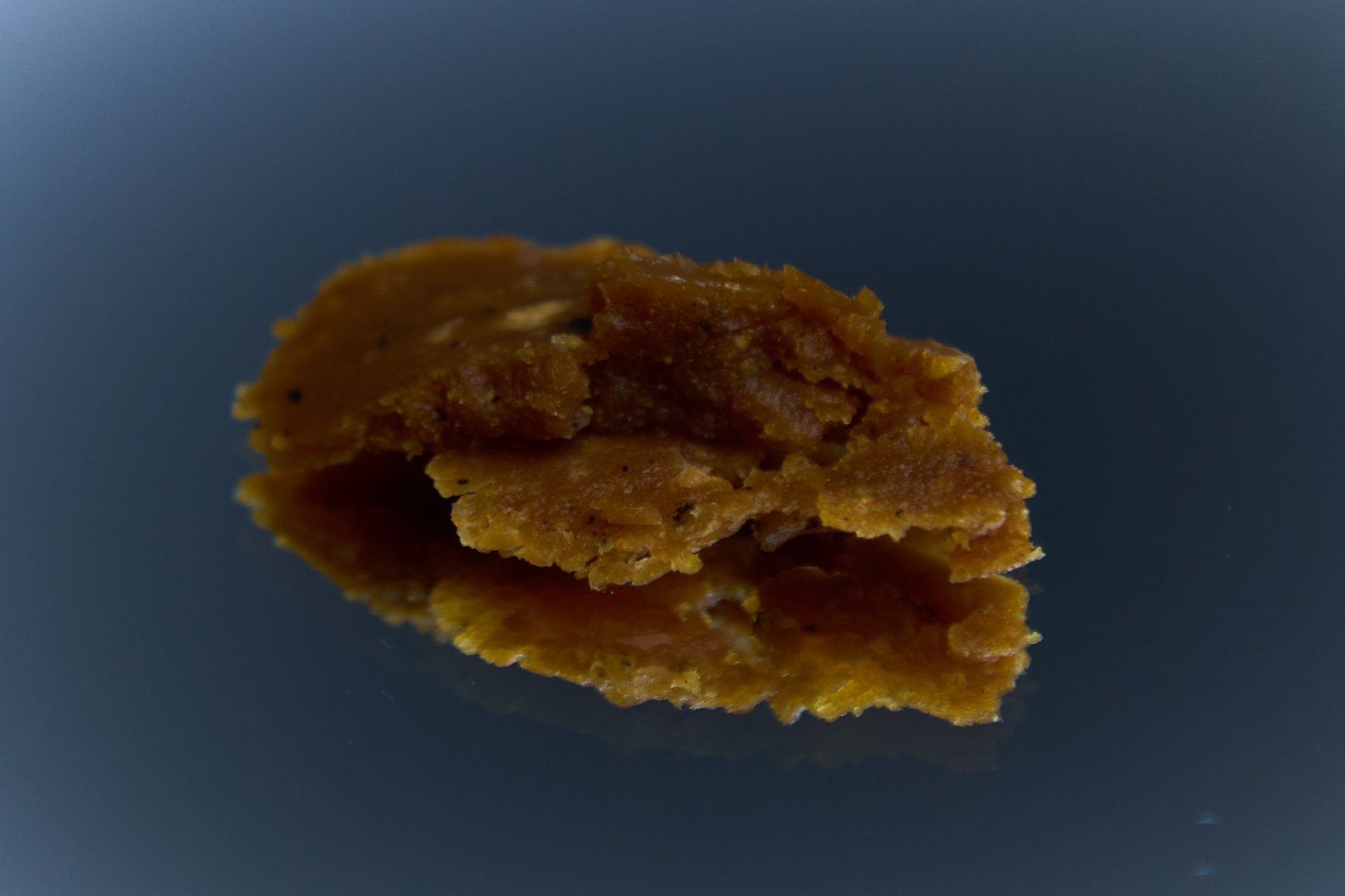 an abstract photo of a curved building with a blue sky in the background