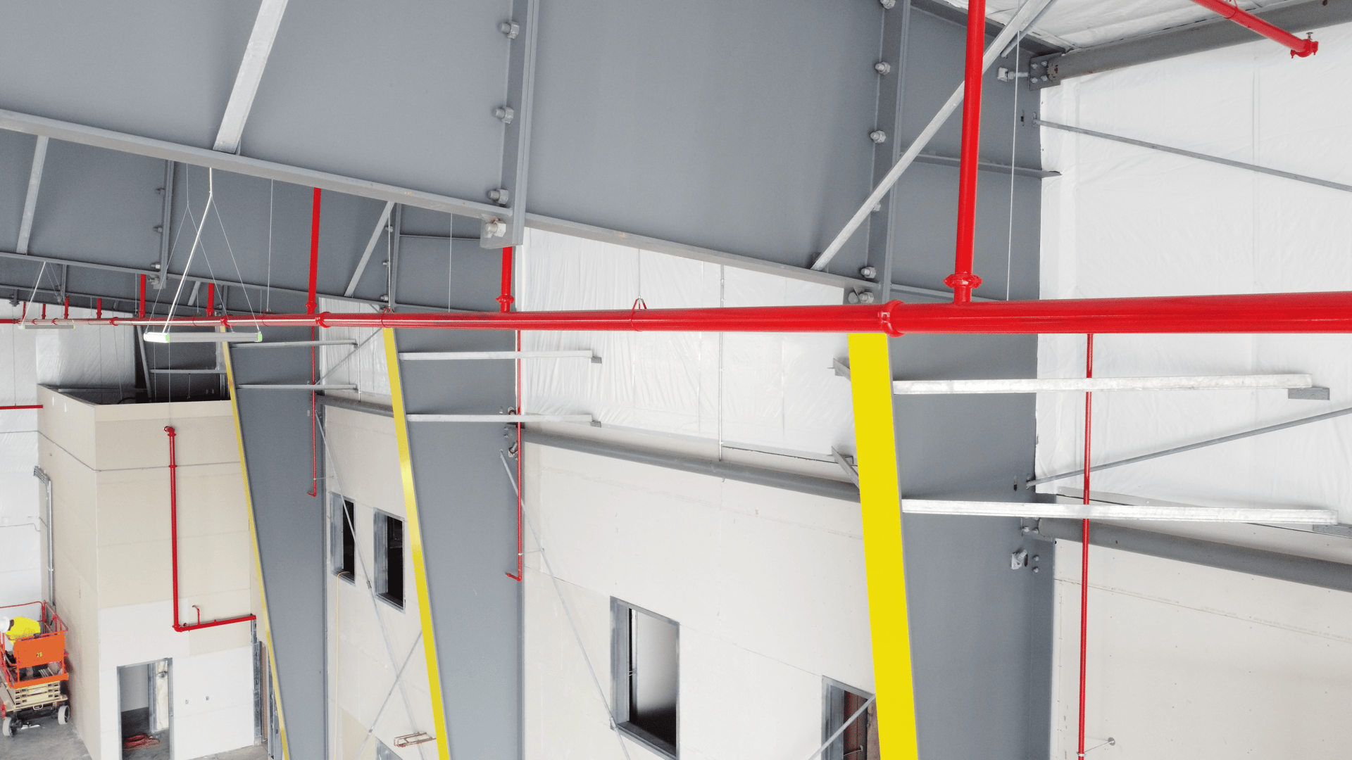 an abstract photo of a curved building with a blue sky in the background