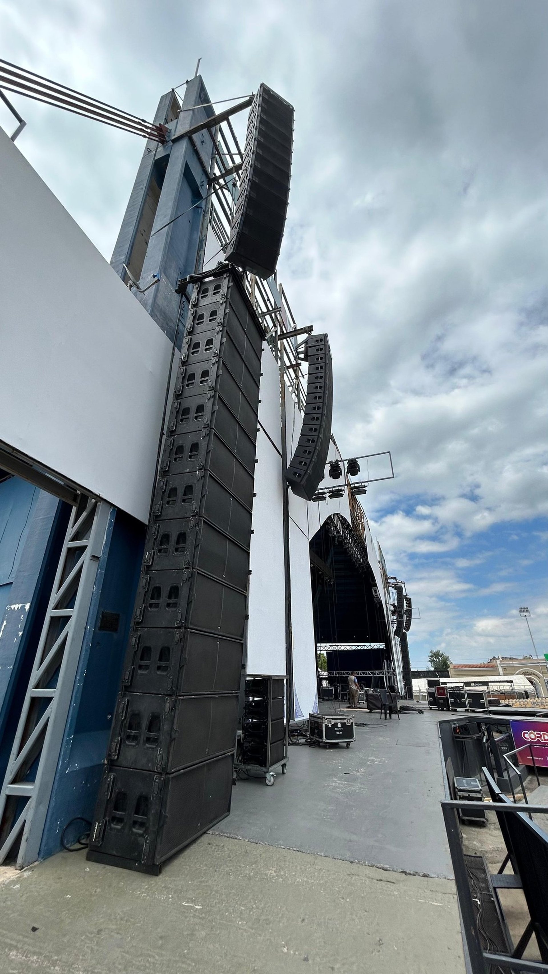 woman wearing yellow long-sleeved dress under white clouds and blue sky during daytime