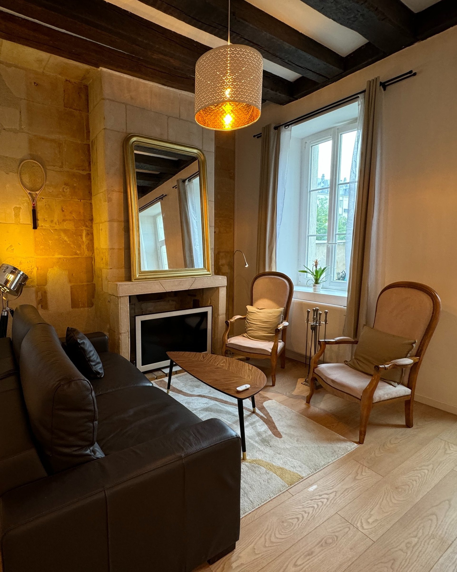 black and brown leather padded tub sofa