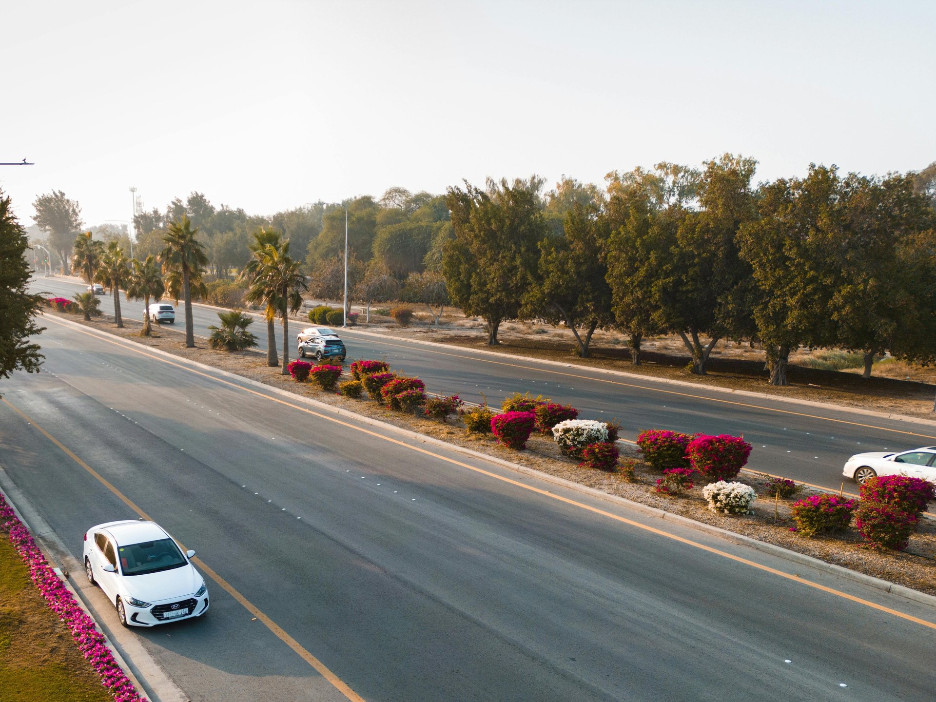a white car parked on the side of the road