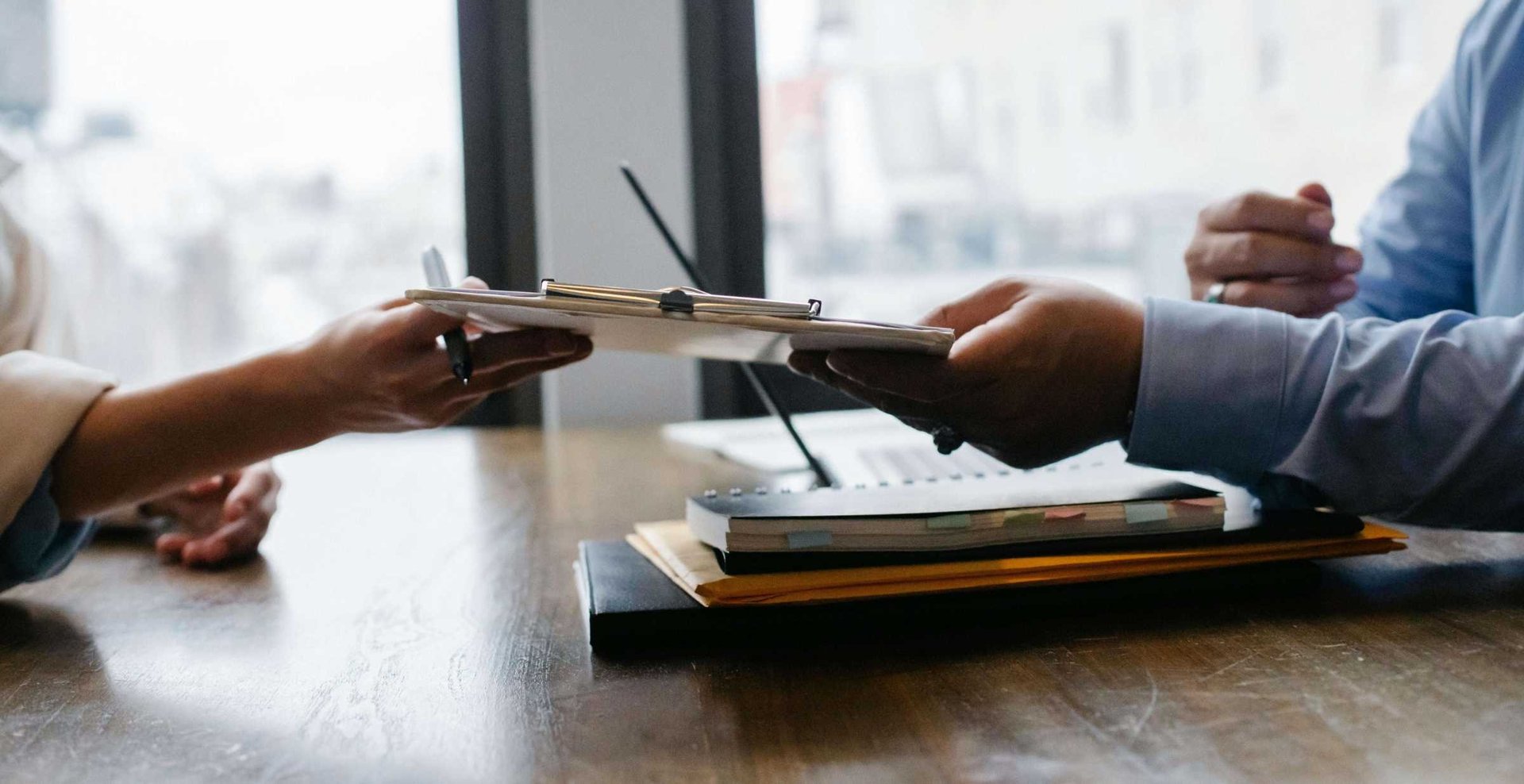 person touching and pointing MacBook Pro