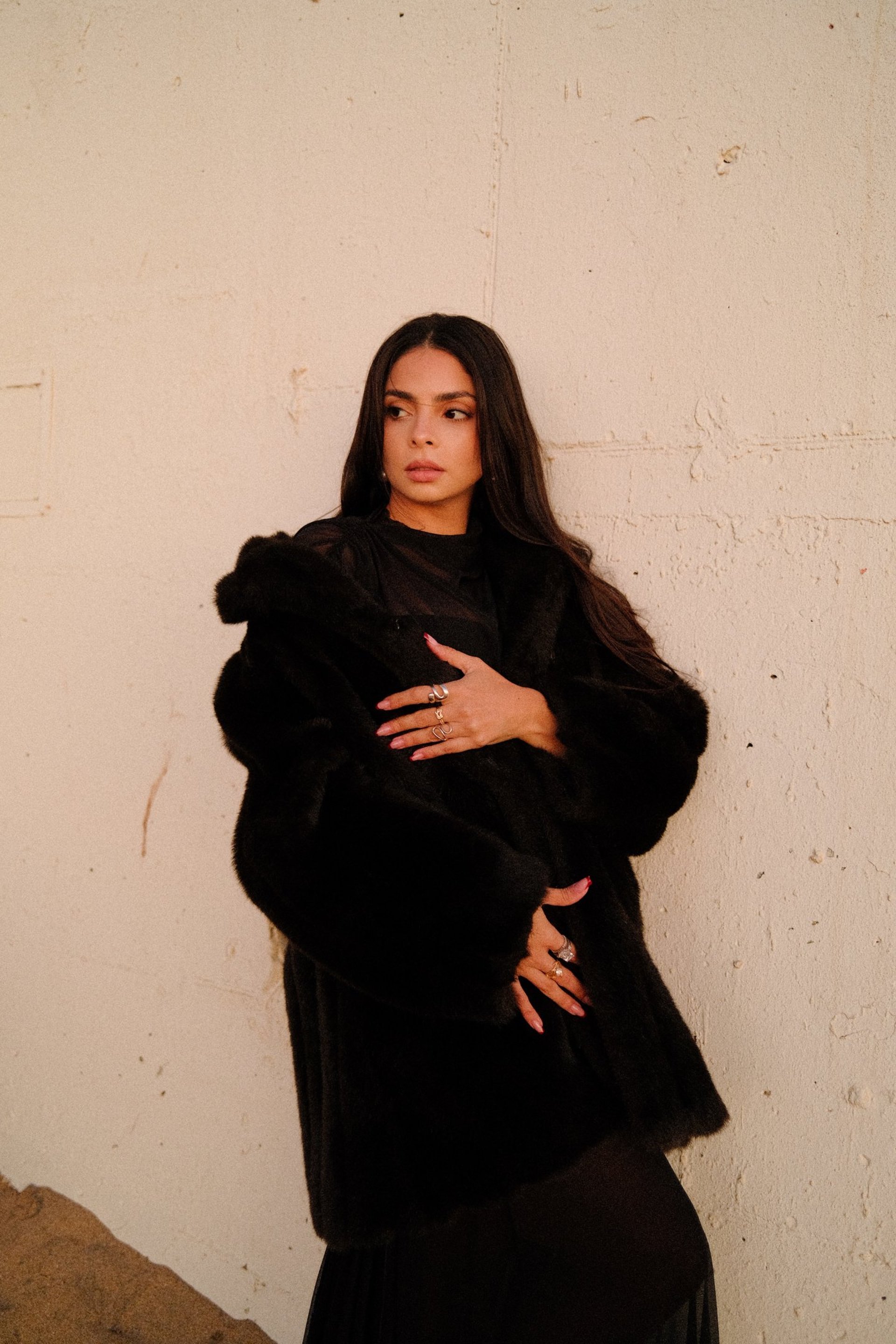 an abstract photo of a curved building with a blue sky in the background