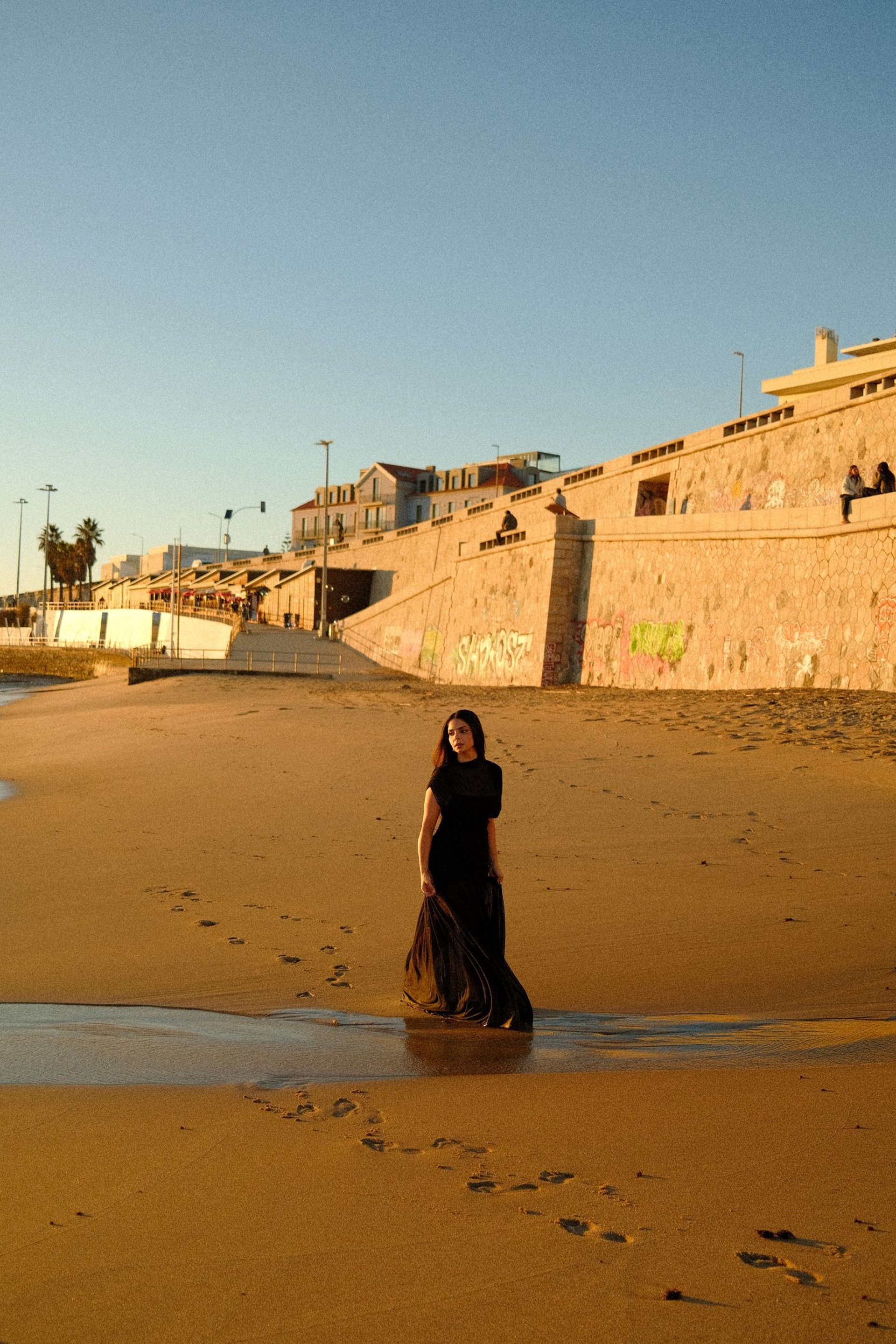 an abstract photo of a curved building with a blue sky in the background