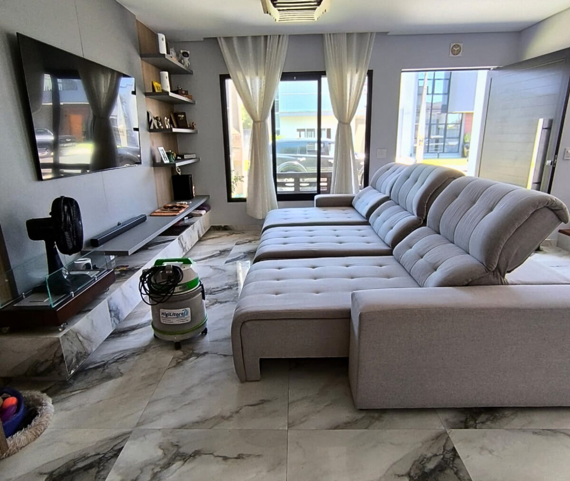 a living room with a couch a chair and a table