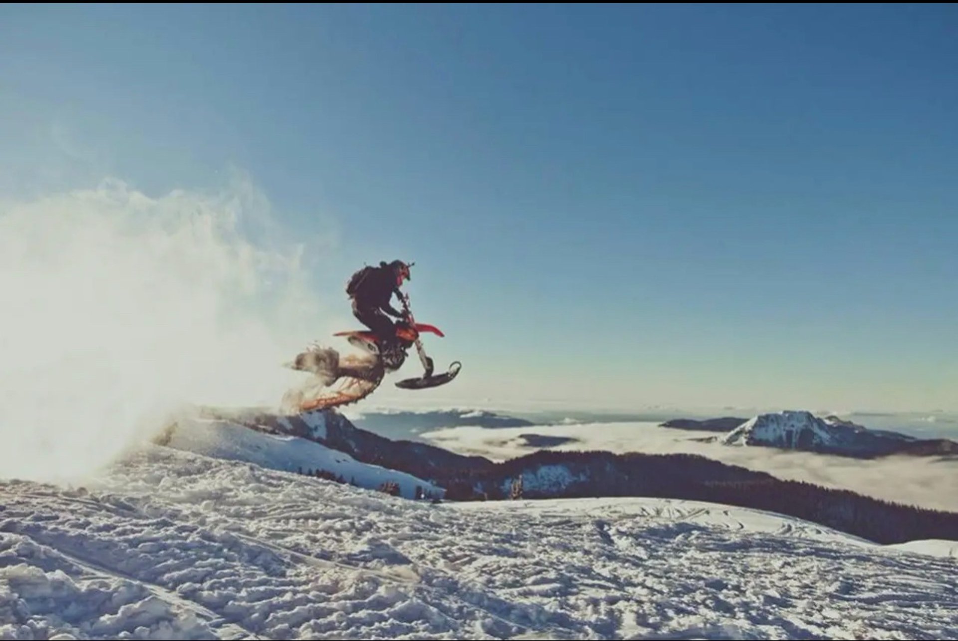 A helicopter rescues people from a snowy area.