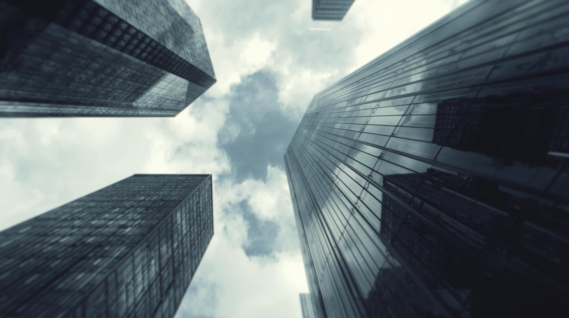 an abstract photo of a curved building with a blue sky in the background