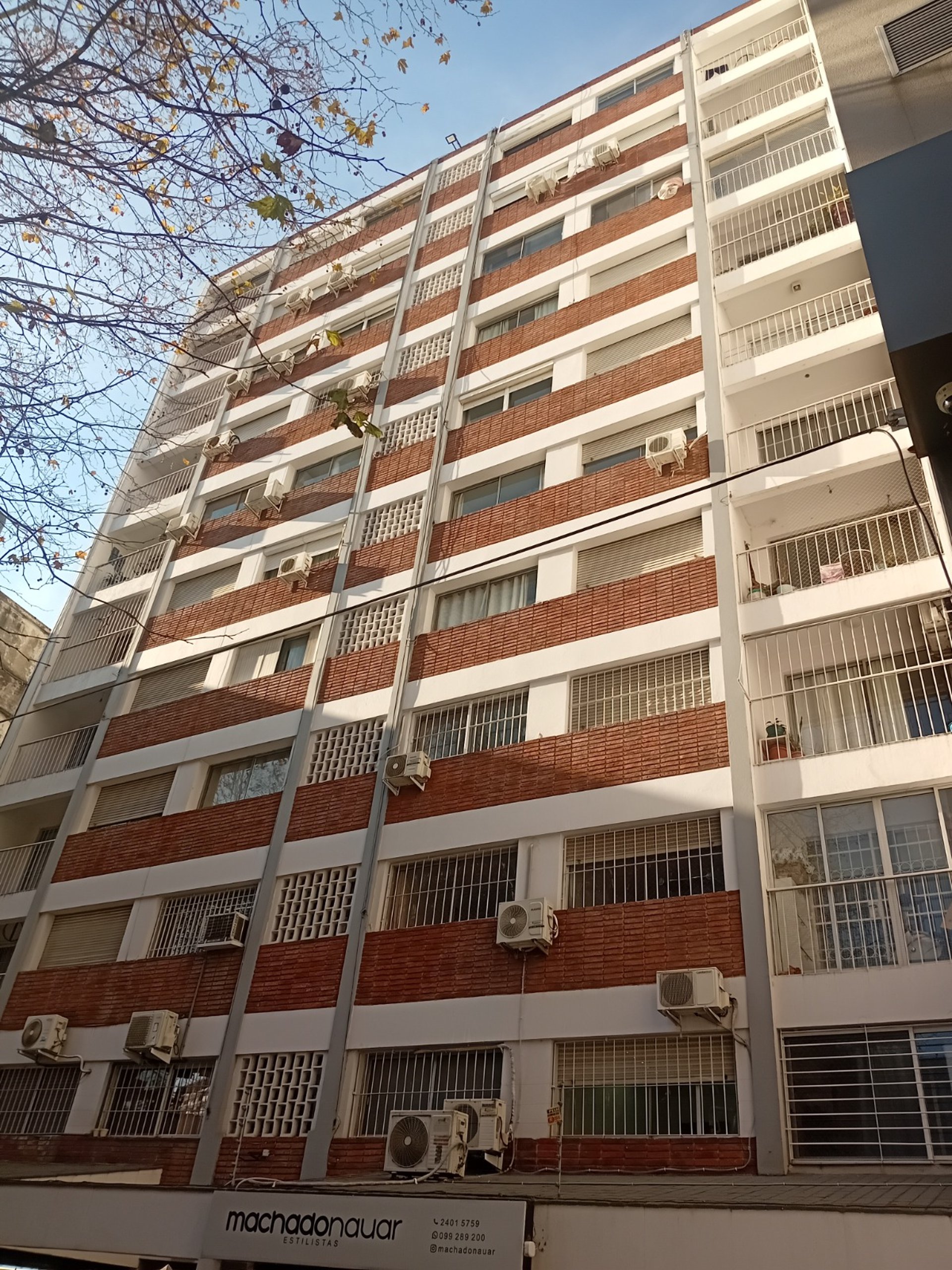 black and brown leather padded tub sofa