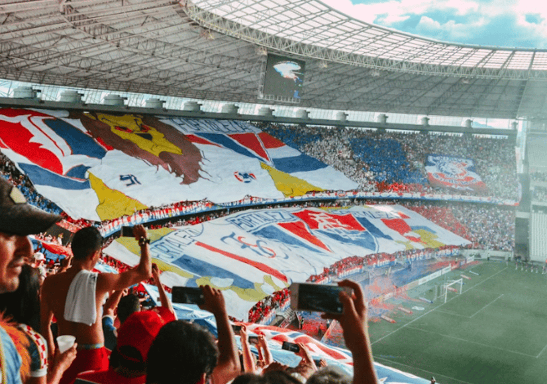 woman wearing yellow long-sleeved dress under white clouds and blue sky during daytime