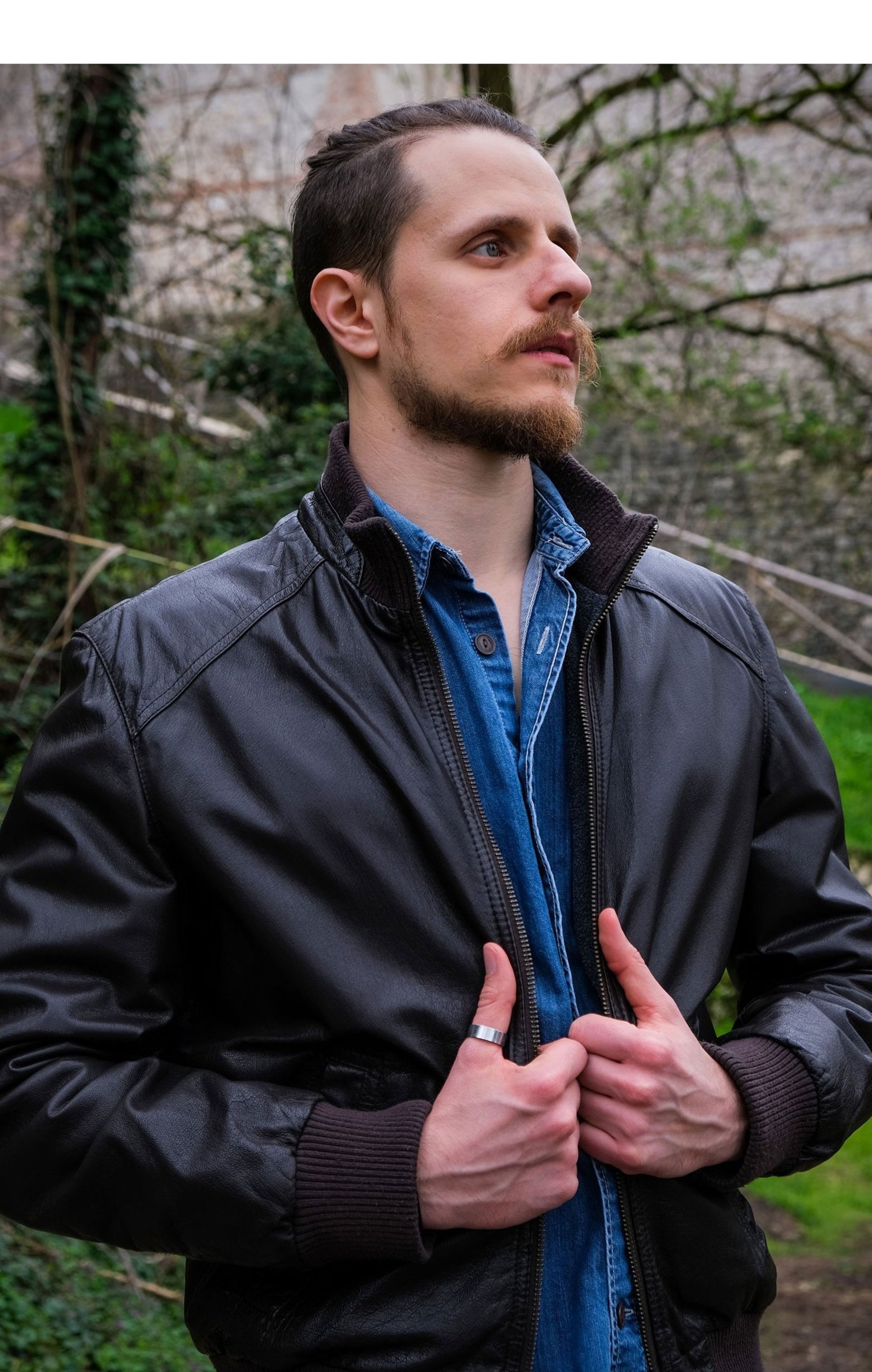 an abstract photo of a curved building with a blue sky in the background