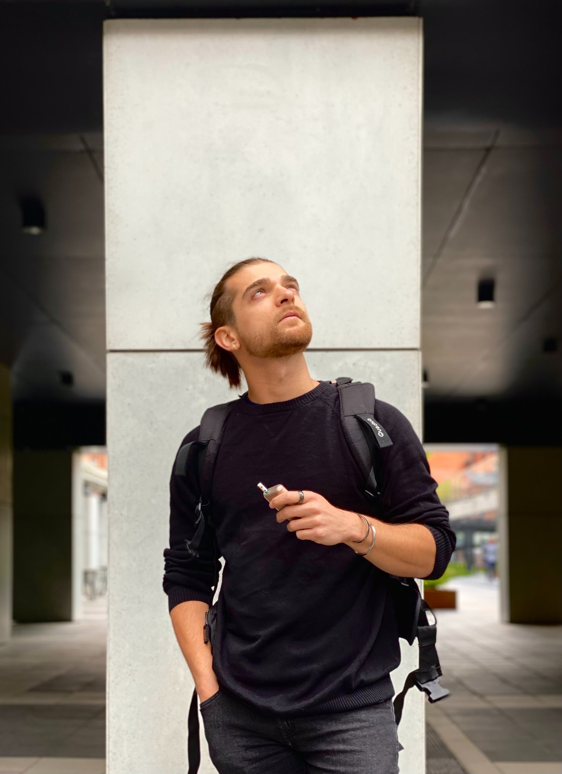 an abstract photo of a curved building with a blue sky in the background