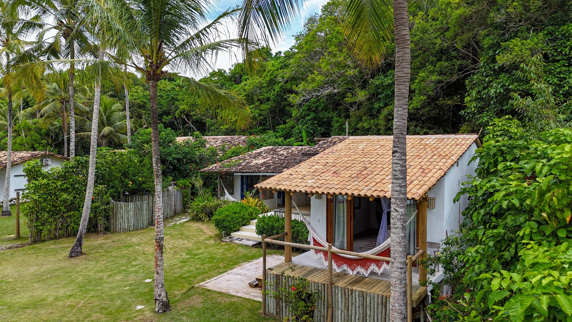 woman wearing yellow long-sleeved dress under white clouds and blue sky during daytime