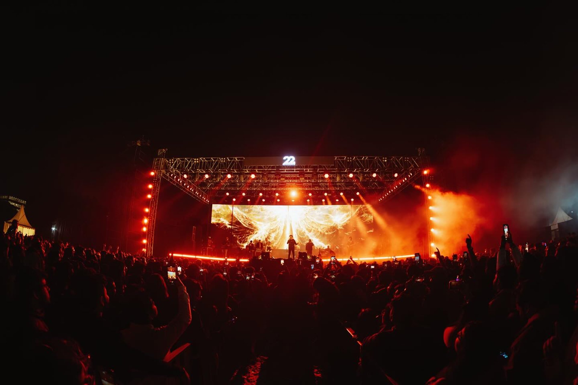woman wearing yellow long-sleeved dress under white clouds and blue sky during daytime