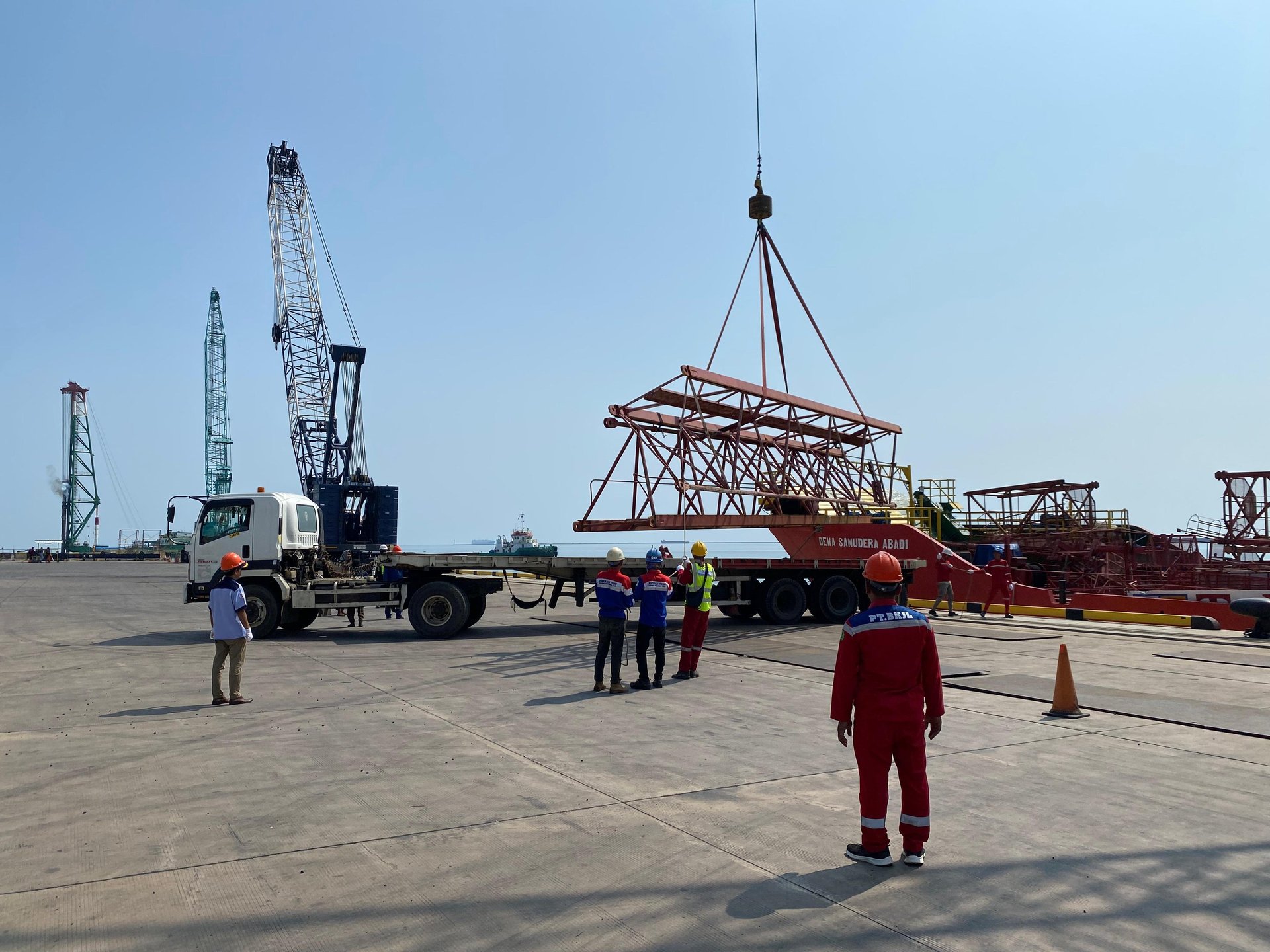 a blue and white bird flying through a blue sky