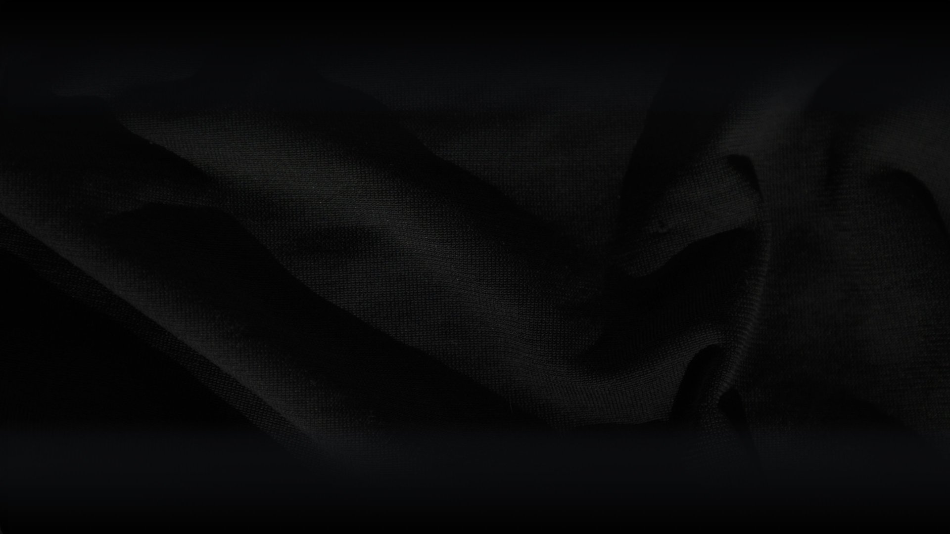 black textile on brown wooden table