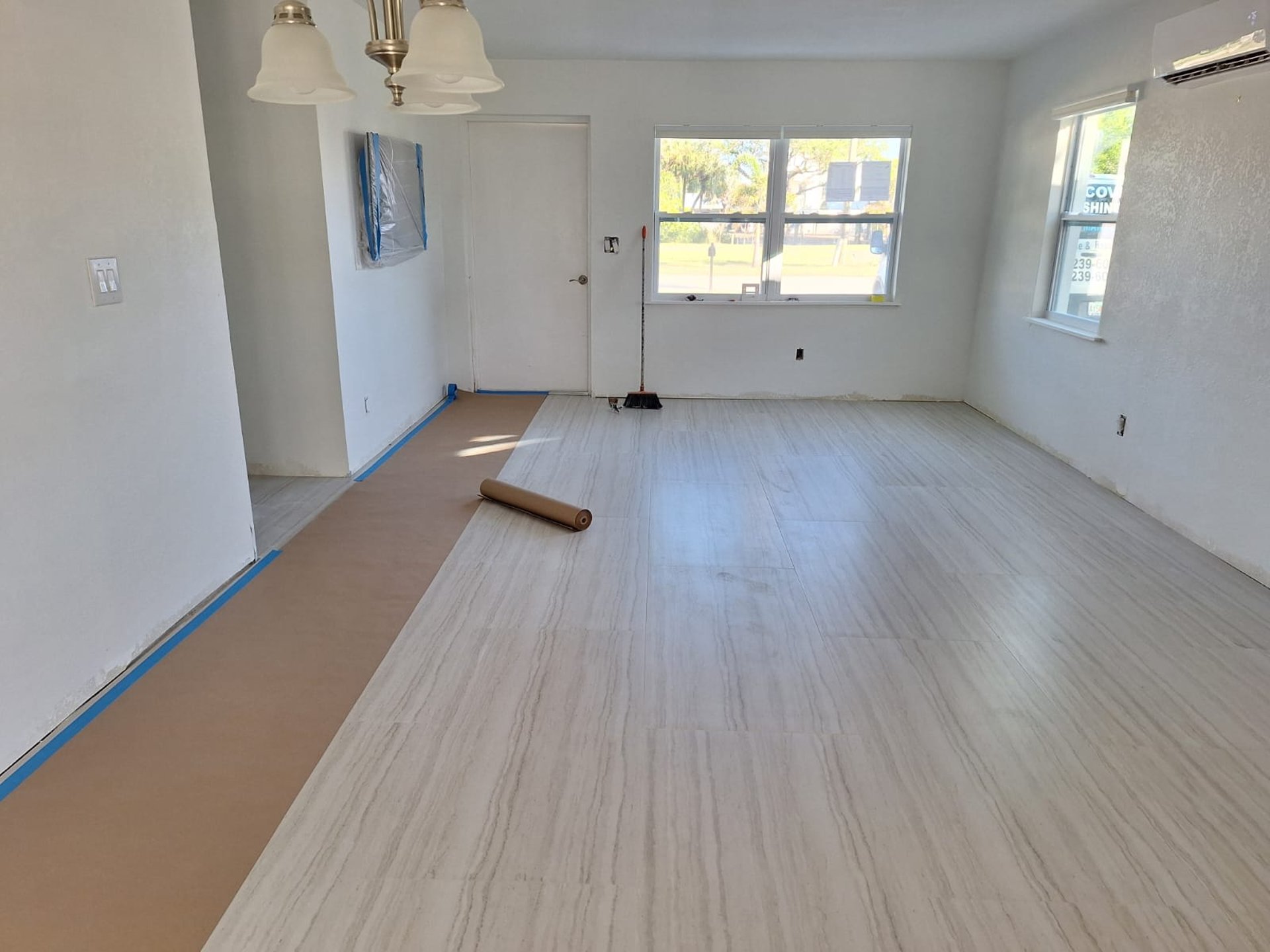 an empty room with wooden walls and beams
