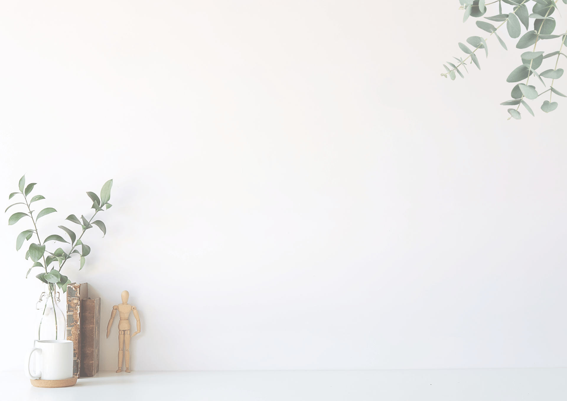 green plant potted on white ceramic vase