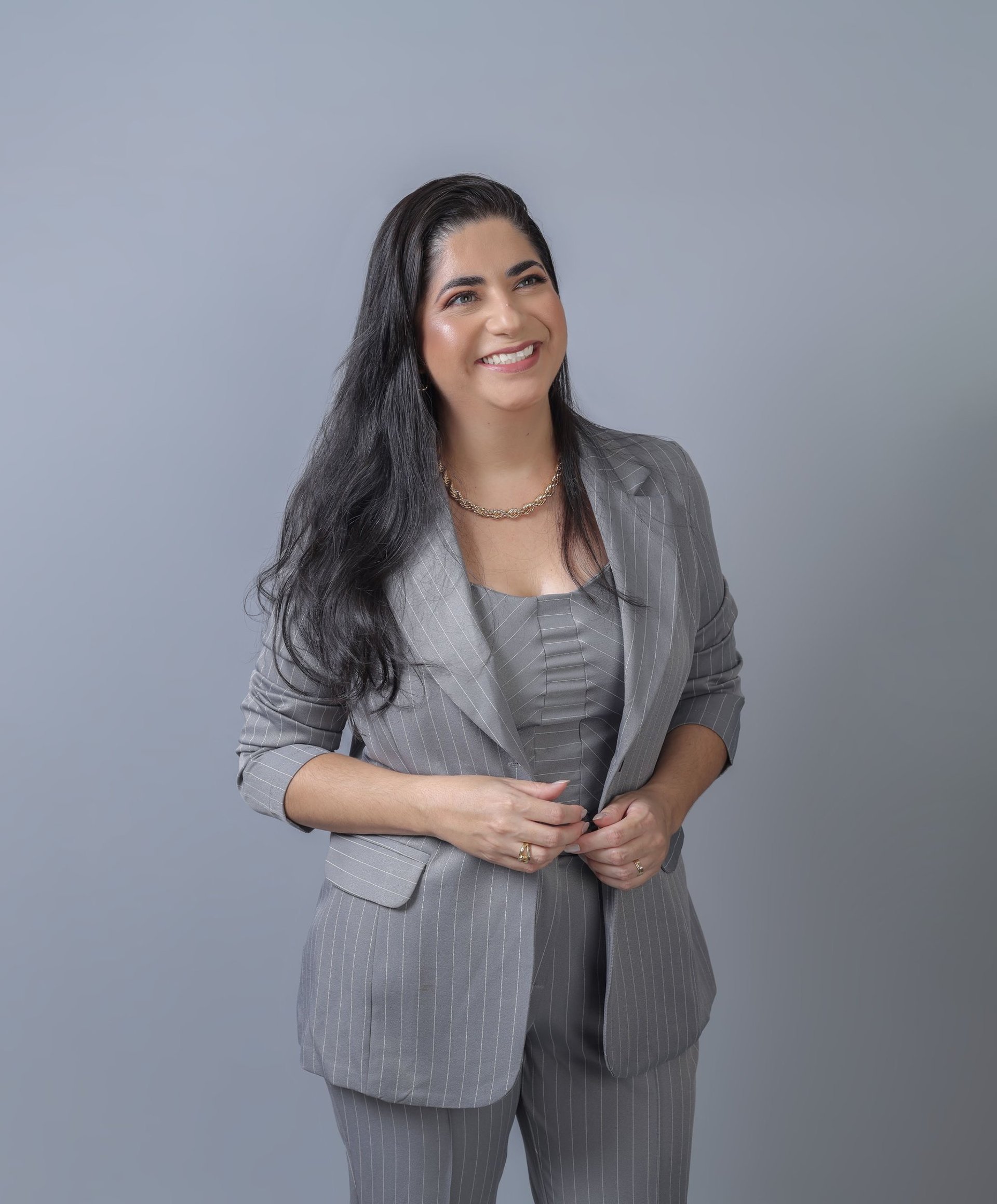 woman wearing yellow long-sleeved dress under white clouds and blue sky during daytime