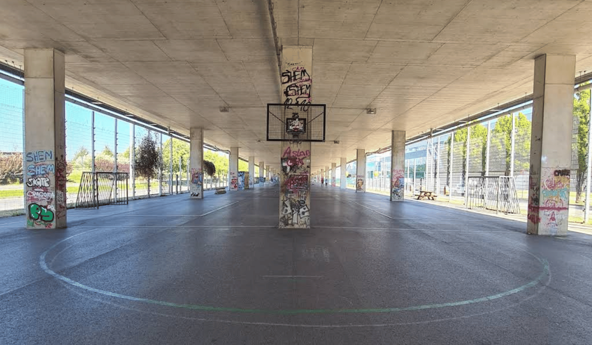 aerial photography of man lying on basketball court