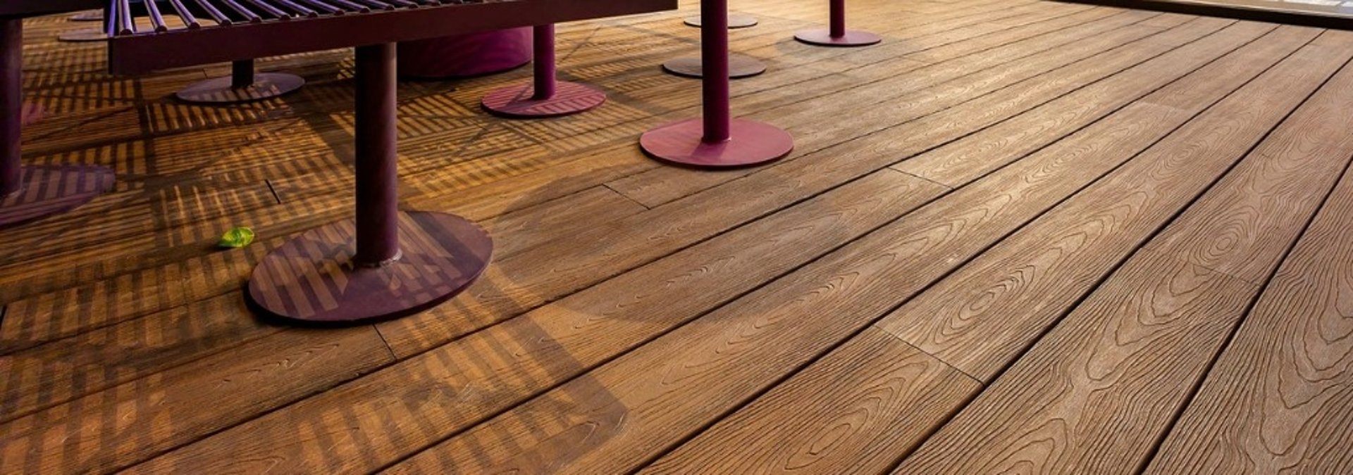 an abstract photo of a curved building with a blue sky in the background