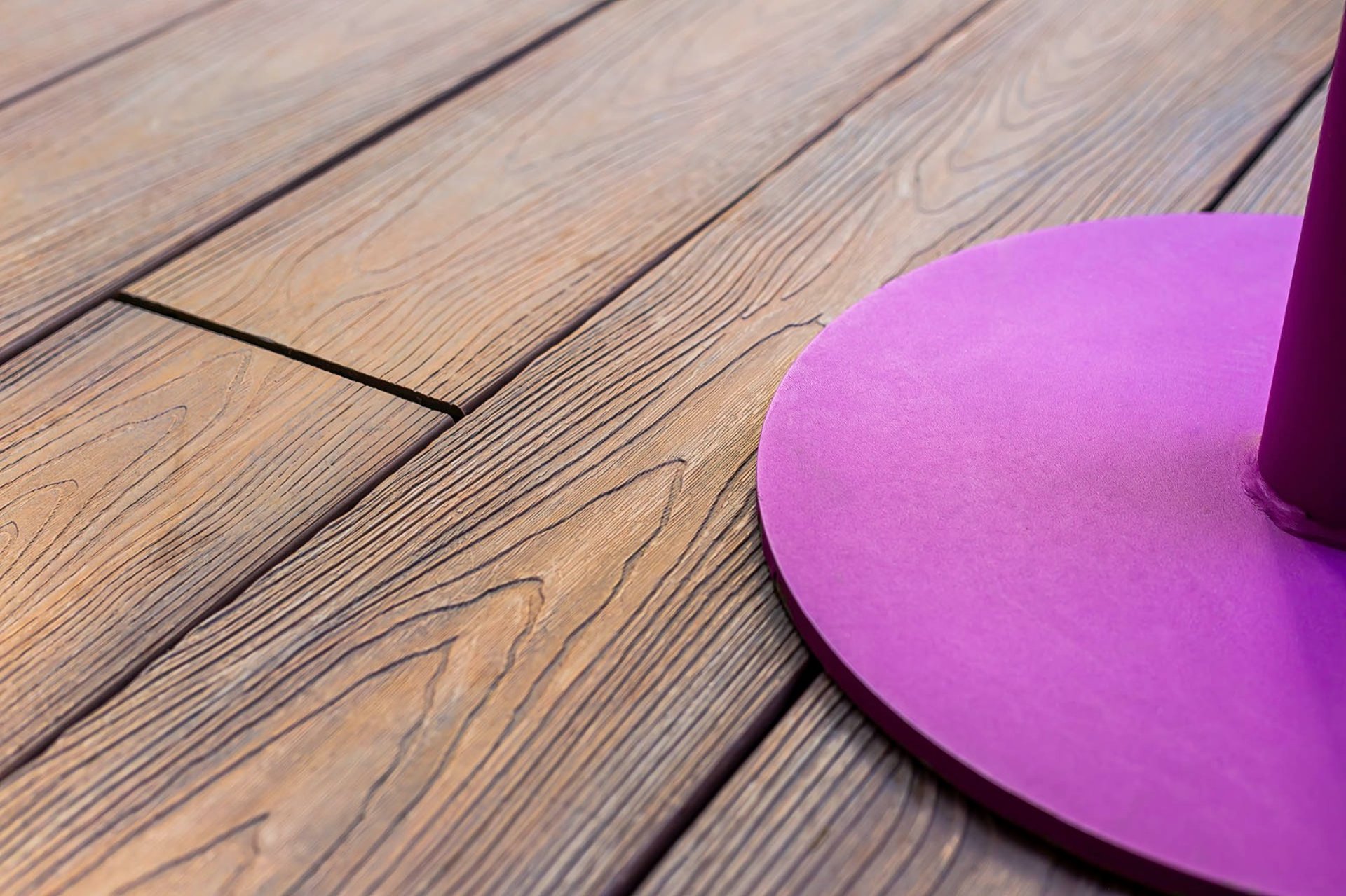 an abstract photo of a curved building with a blue sky in the background