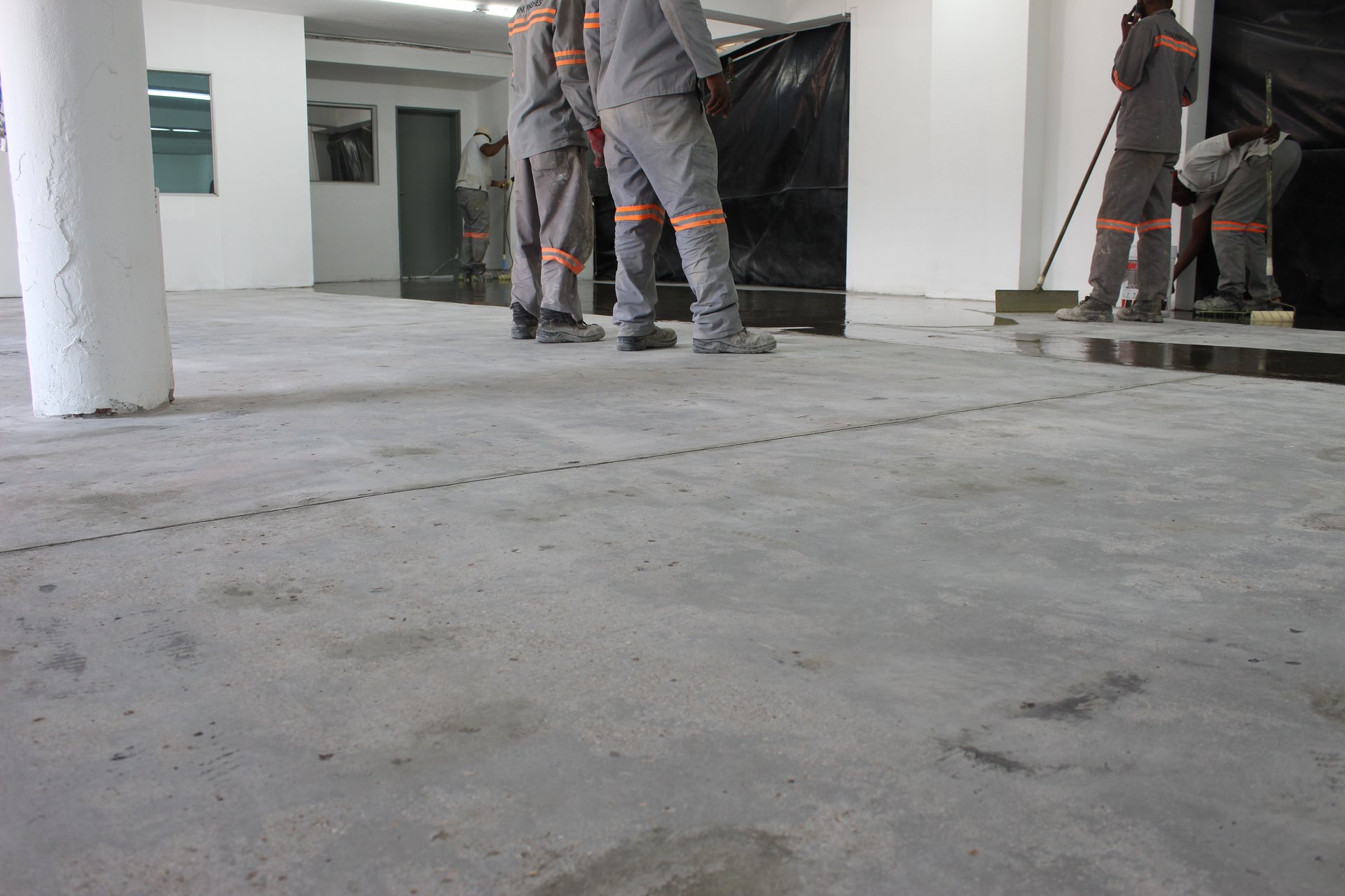 Industrial epoxy floor system application in commercial facility in Gaborone, Botswana