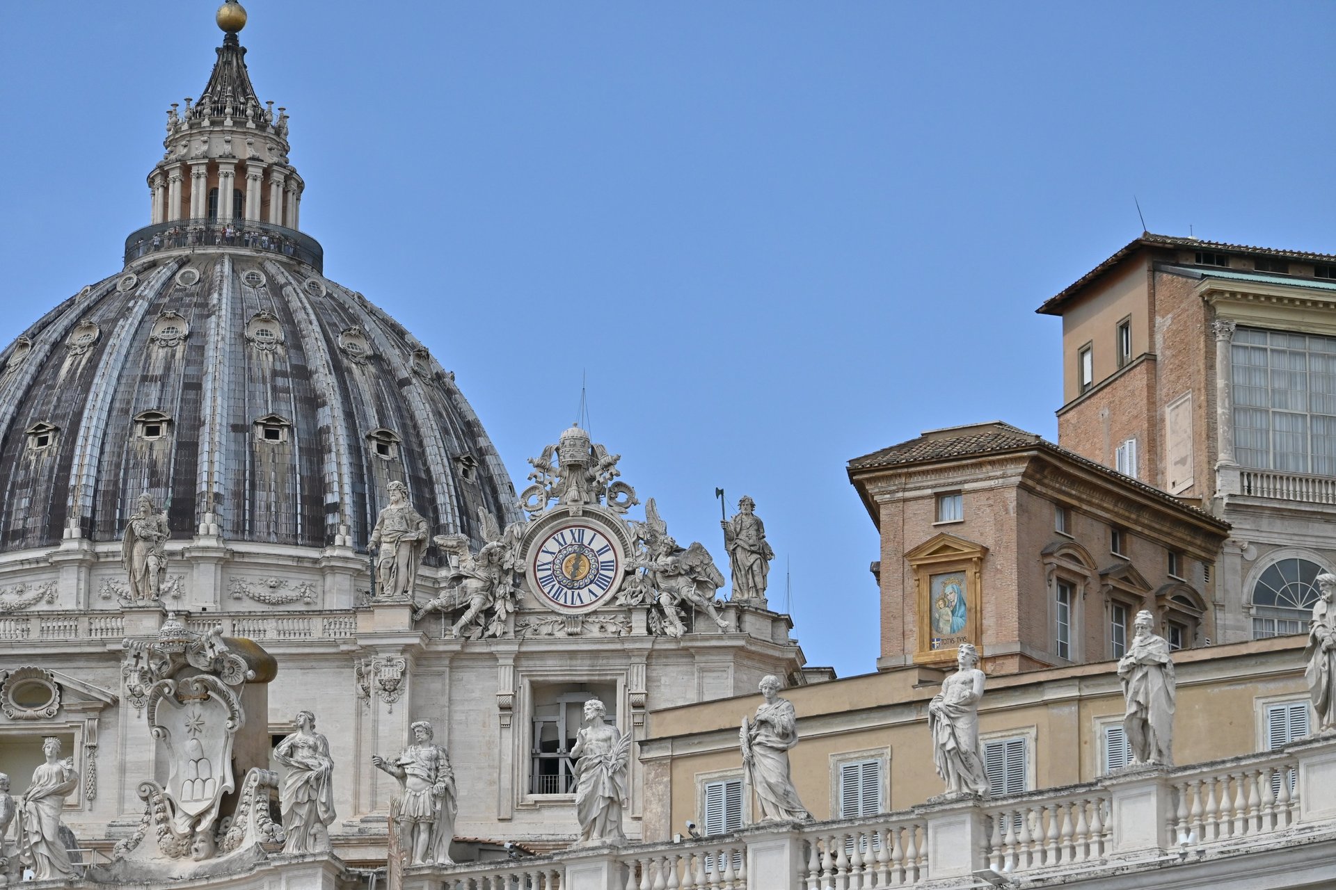 an abstract photo of a curved building with a blue sky in the background
