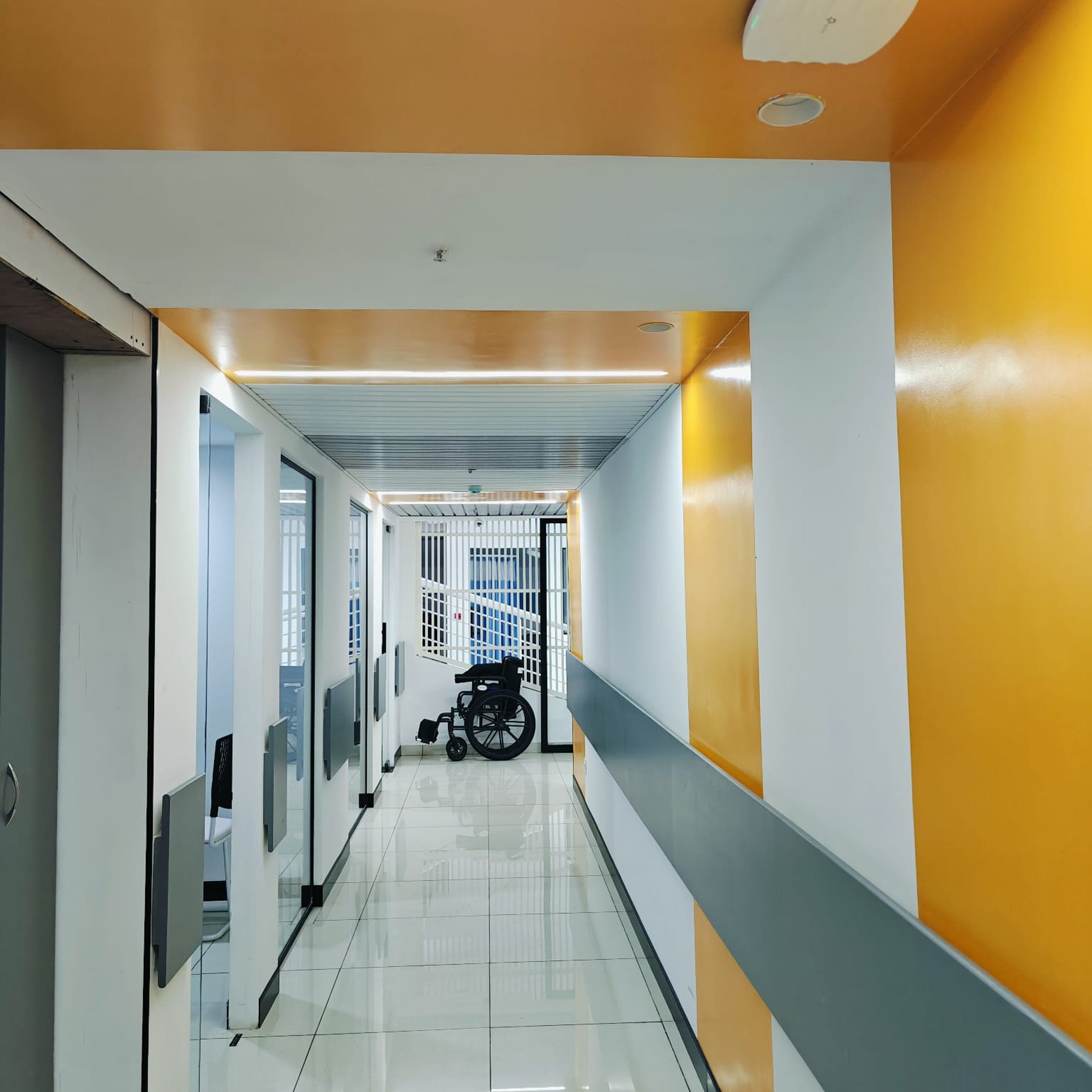 woman wearing yellow long-sleeved dress under white clouds and blue sky during daytime