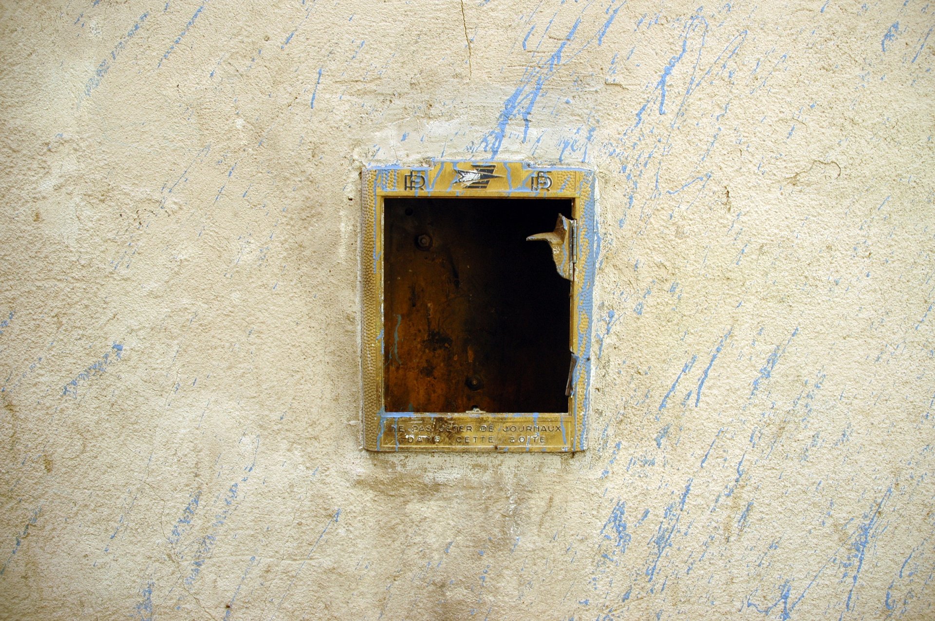 an abstract photo of a curved building with a blue sky in the background
