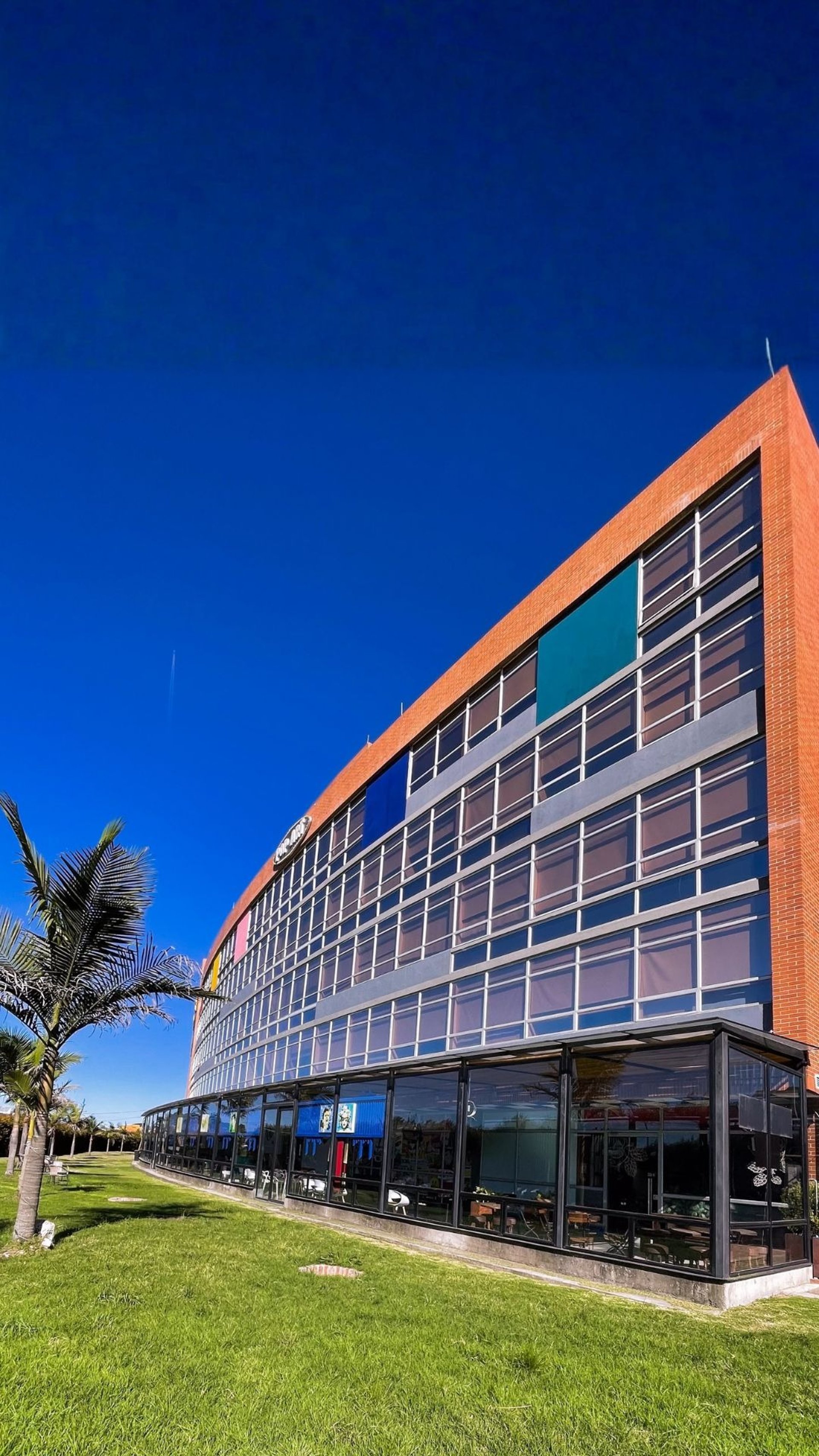 gray table lamp beside white bed pillow