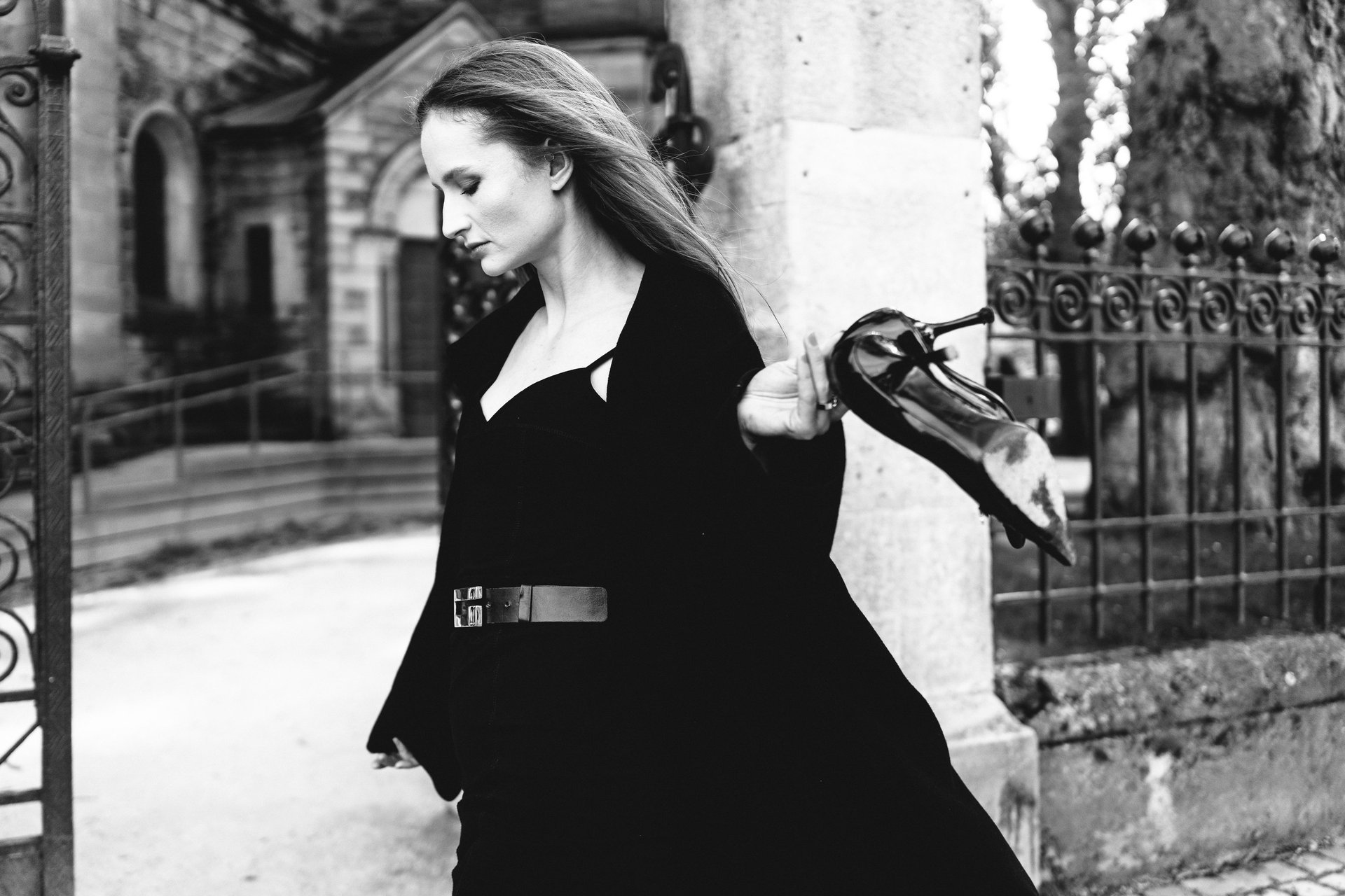 an abstract photo of a curved building with a blue sky in the background