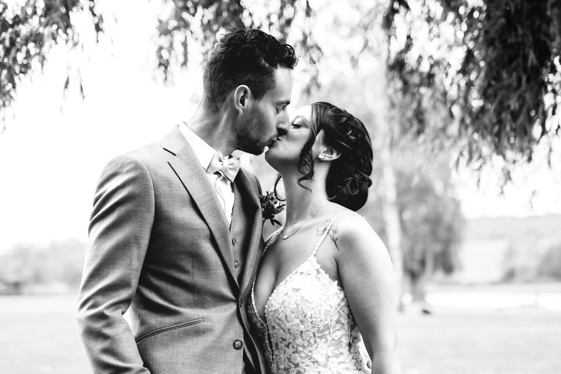 bride and groom on green grass field
