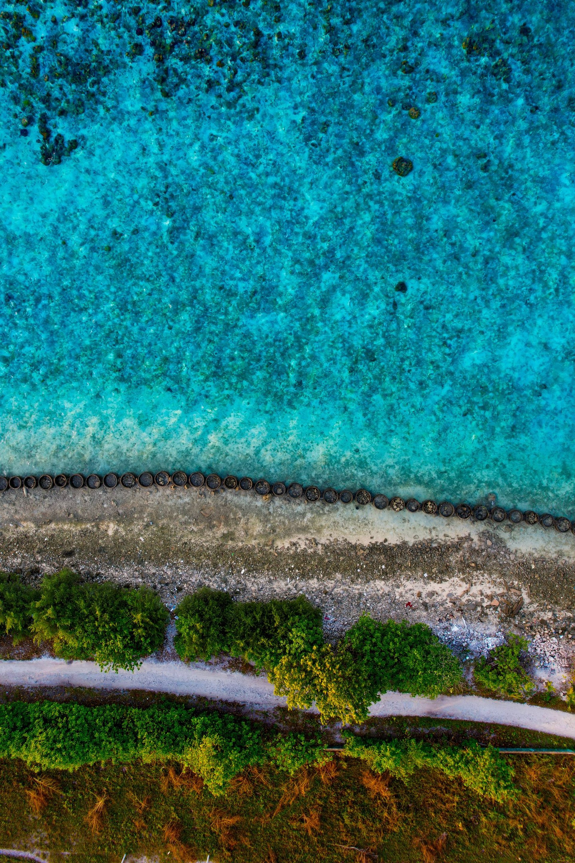 a small boat floating on top of a body of water
