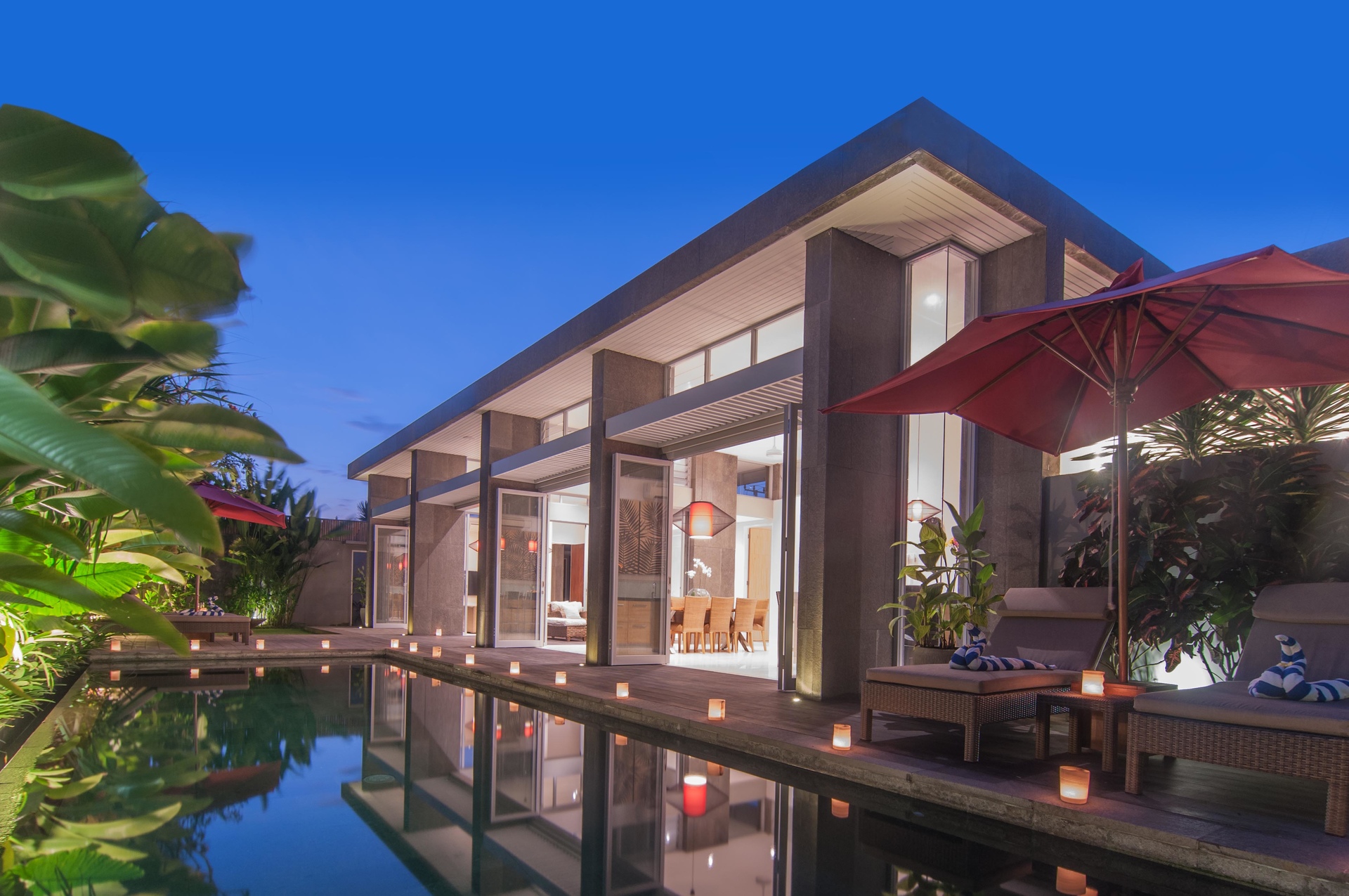 an abstract photo of a curved building with a blue sky in the background