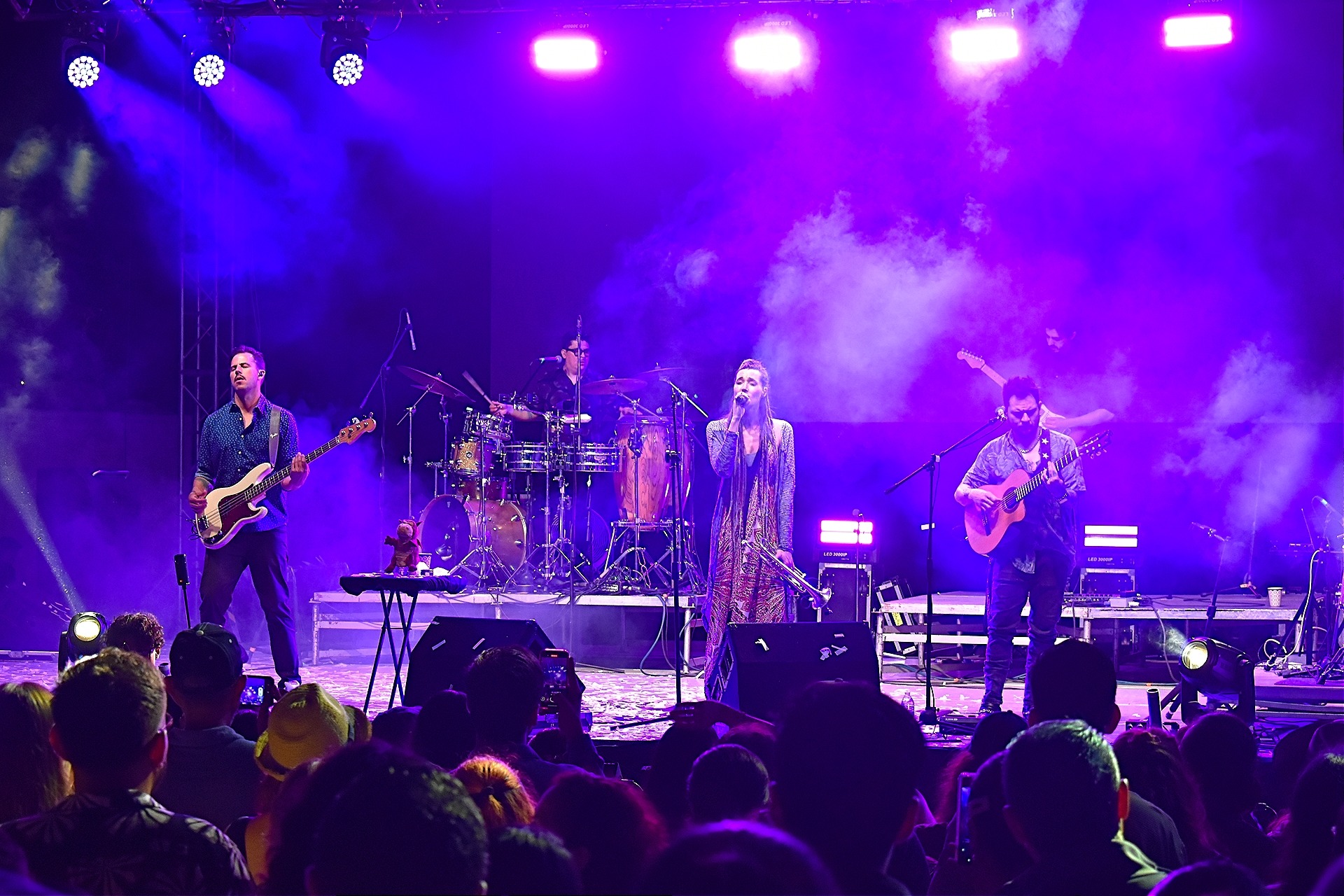 an abstract photo of a curved building with a blue sky in the background