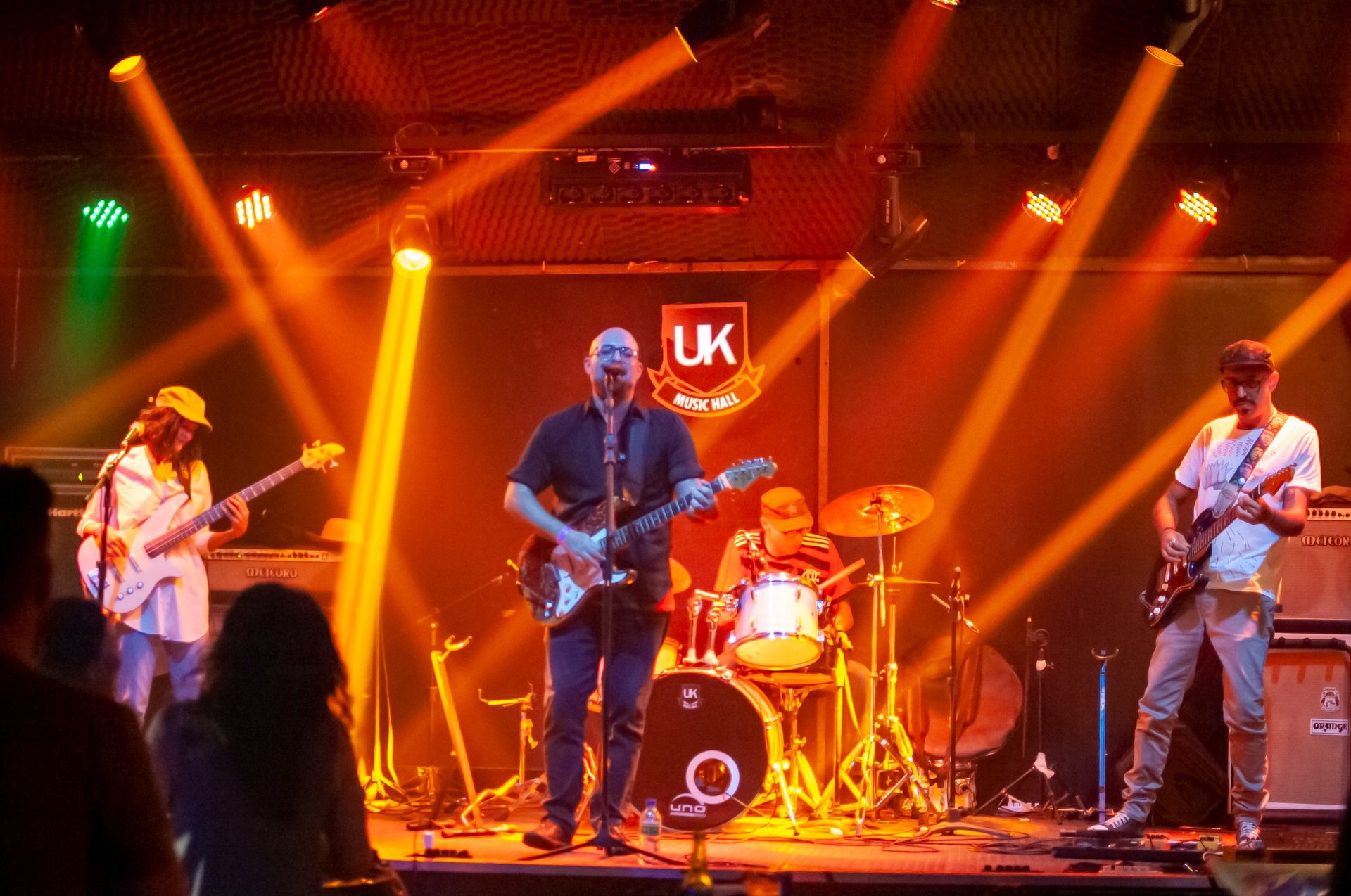 woman wearing yellow long-sleeved dress under white clouds and blue sky during daytime