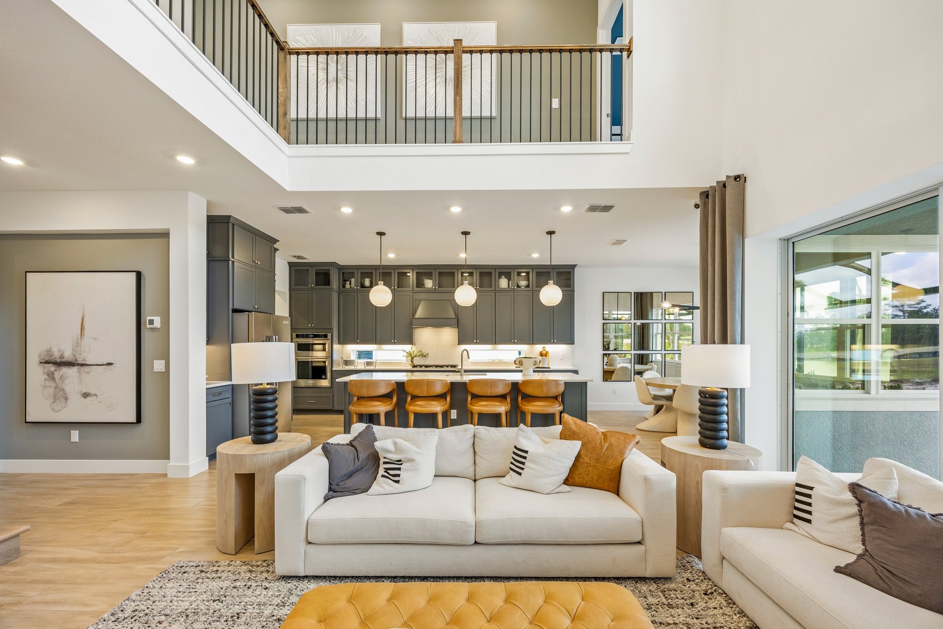 Stylized living room scene featuring large living space inviting buyers to envision home