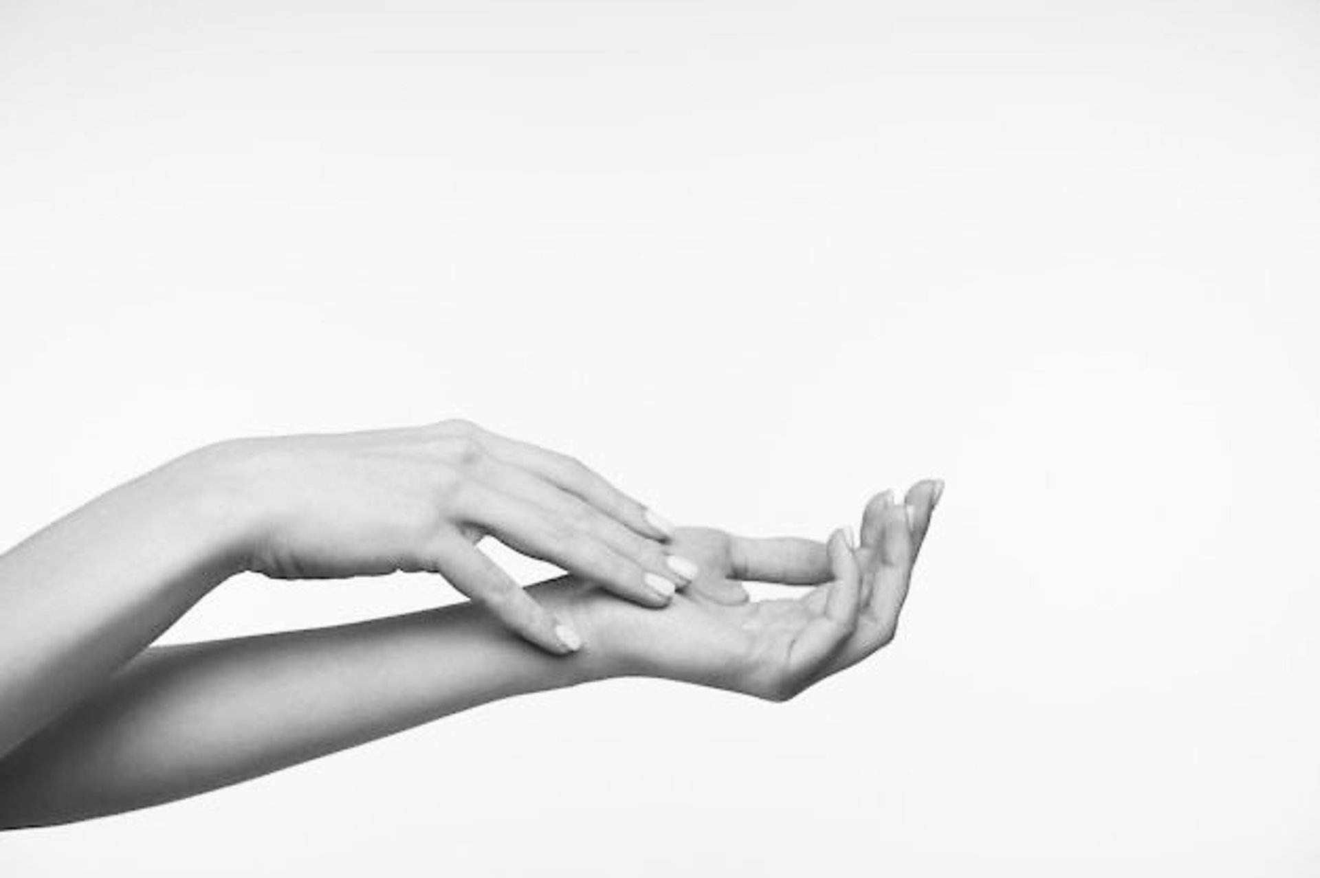 time lapse photography of water hitting left palm