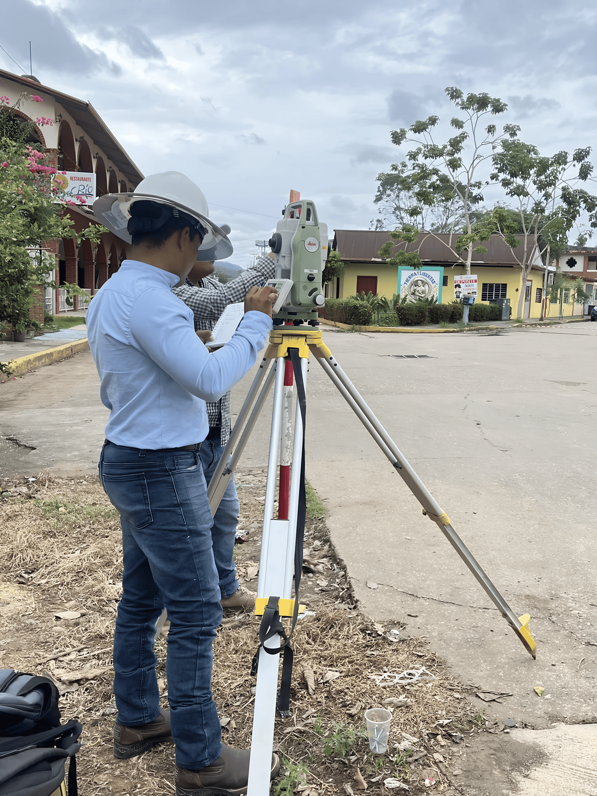 orange and white excavator on brown ground during daytime