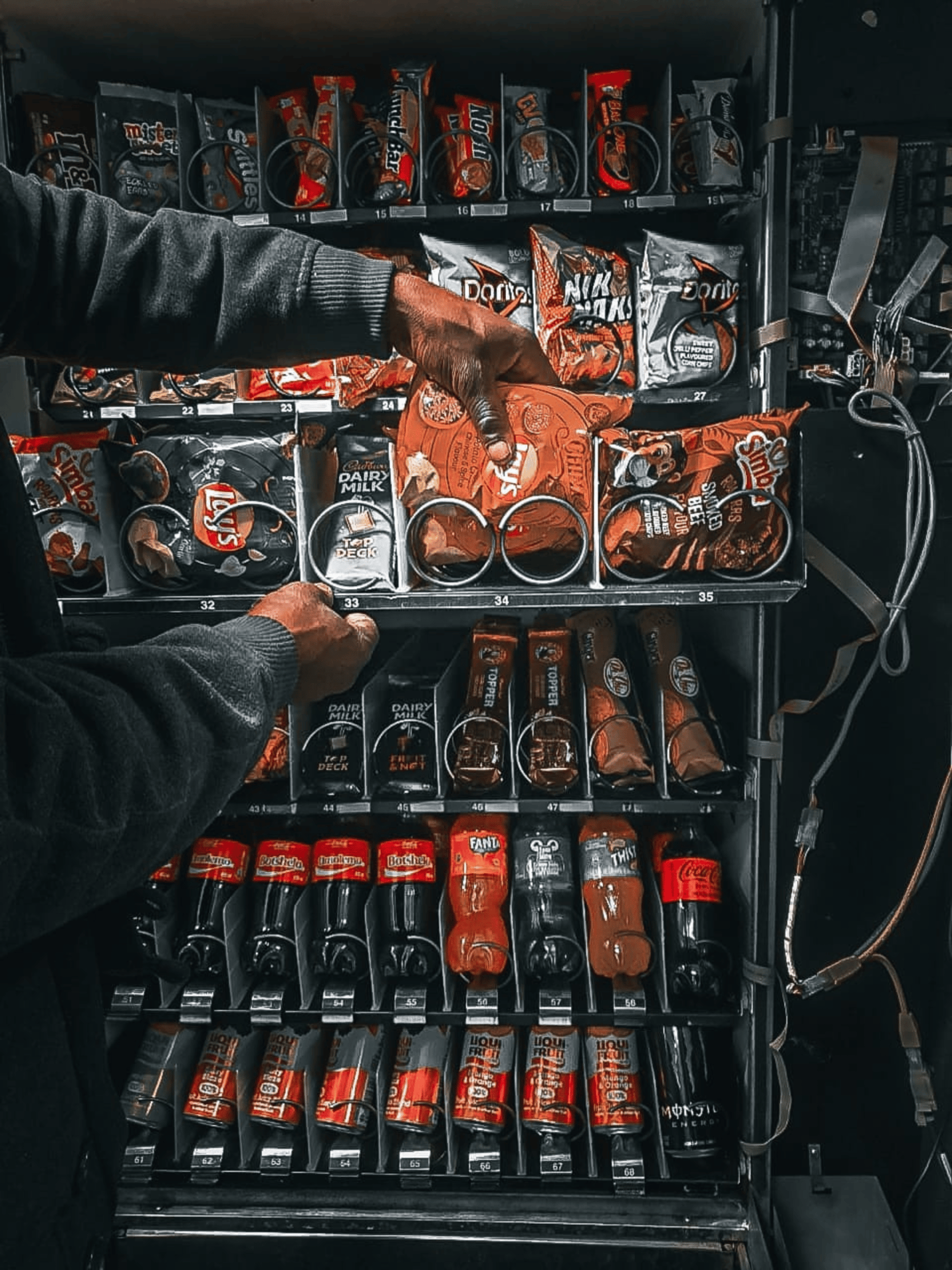 a vending machine with drinks and snacks in it