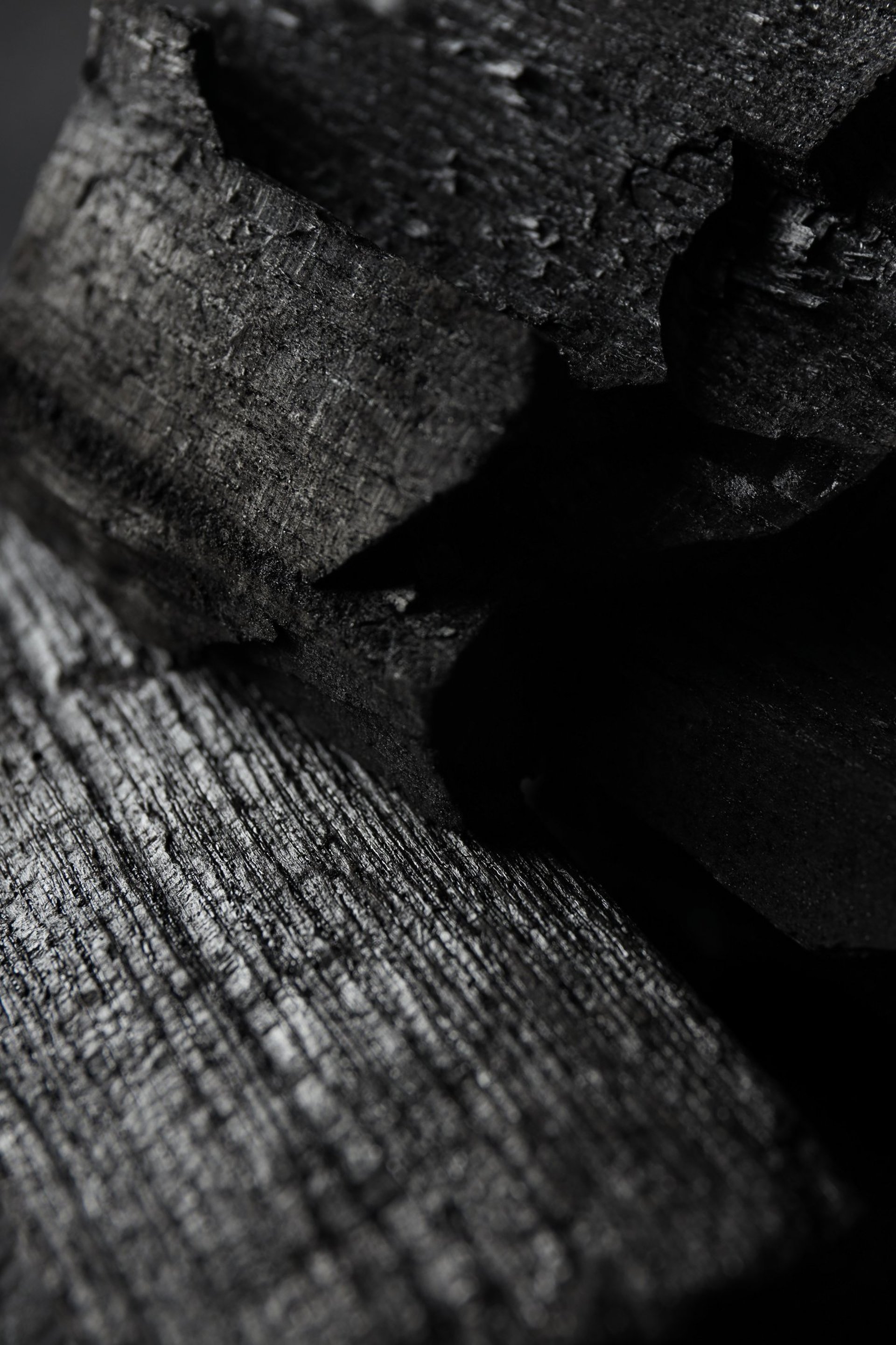 a close up of a black and brown abstract painting