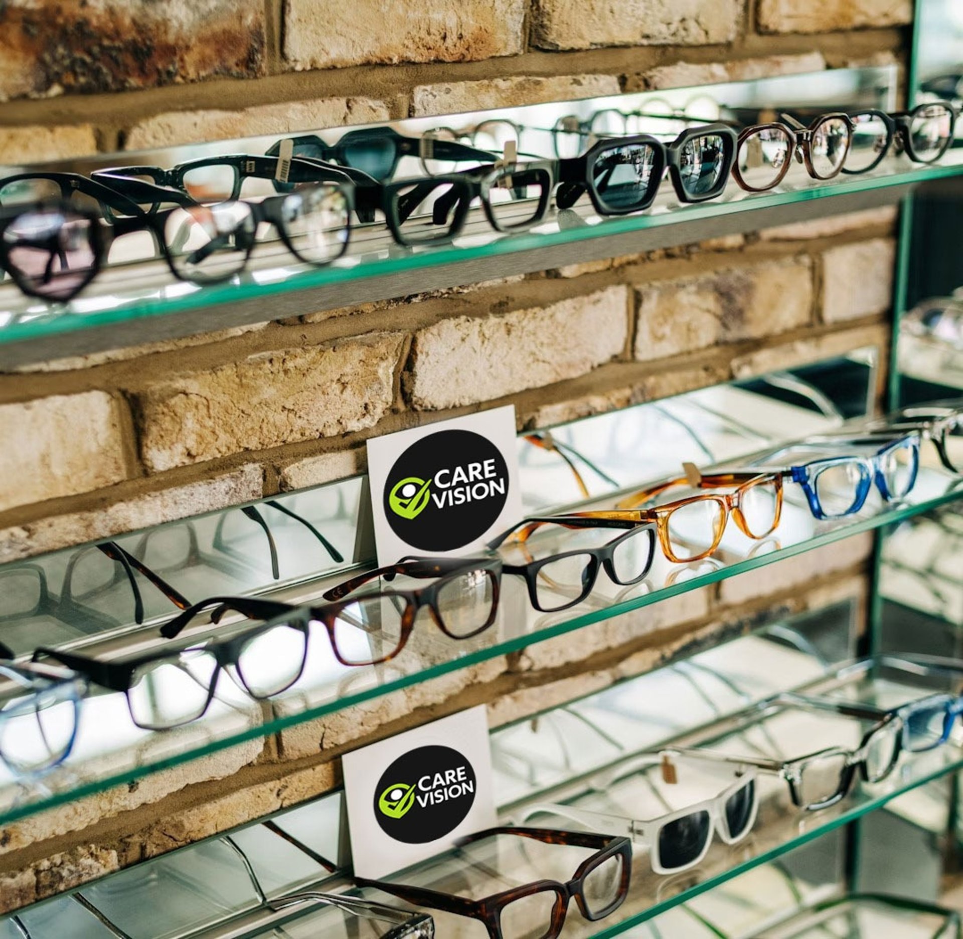 a display case with many pairs of glasses