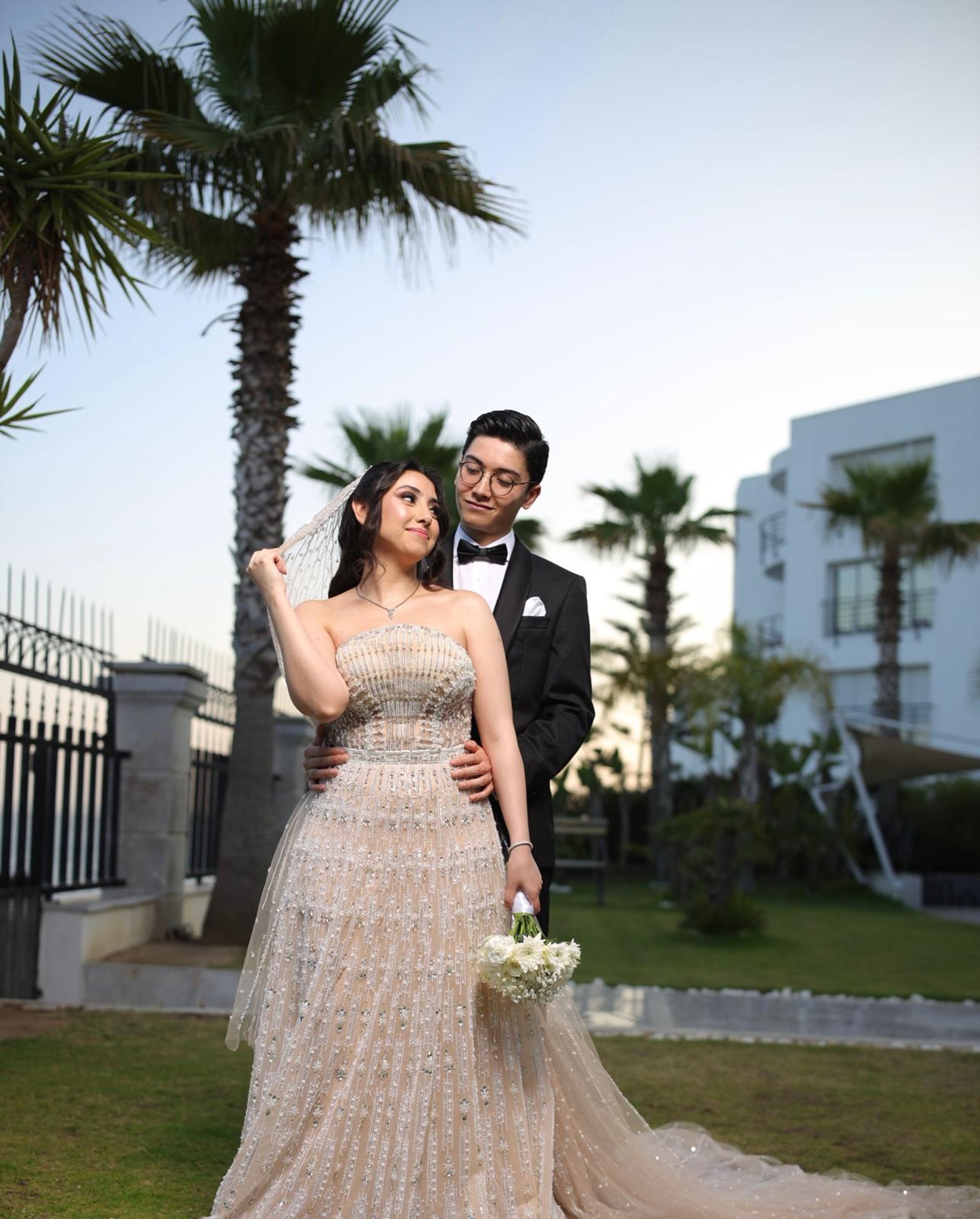 couple wearing silver-colored rings