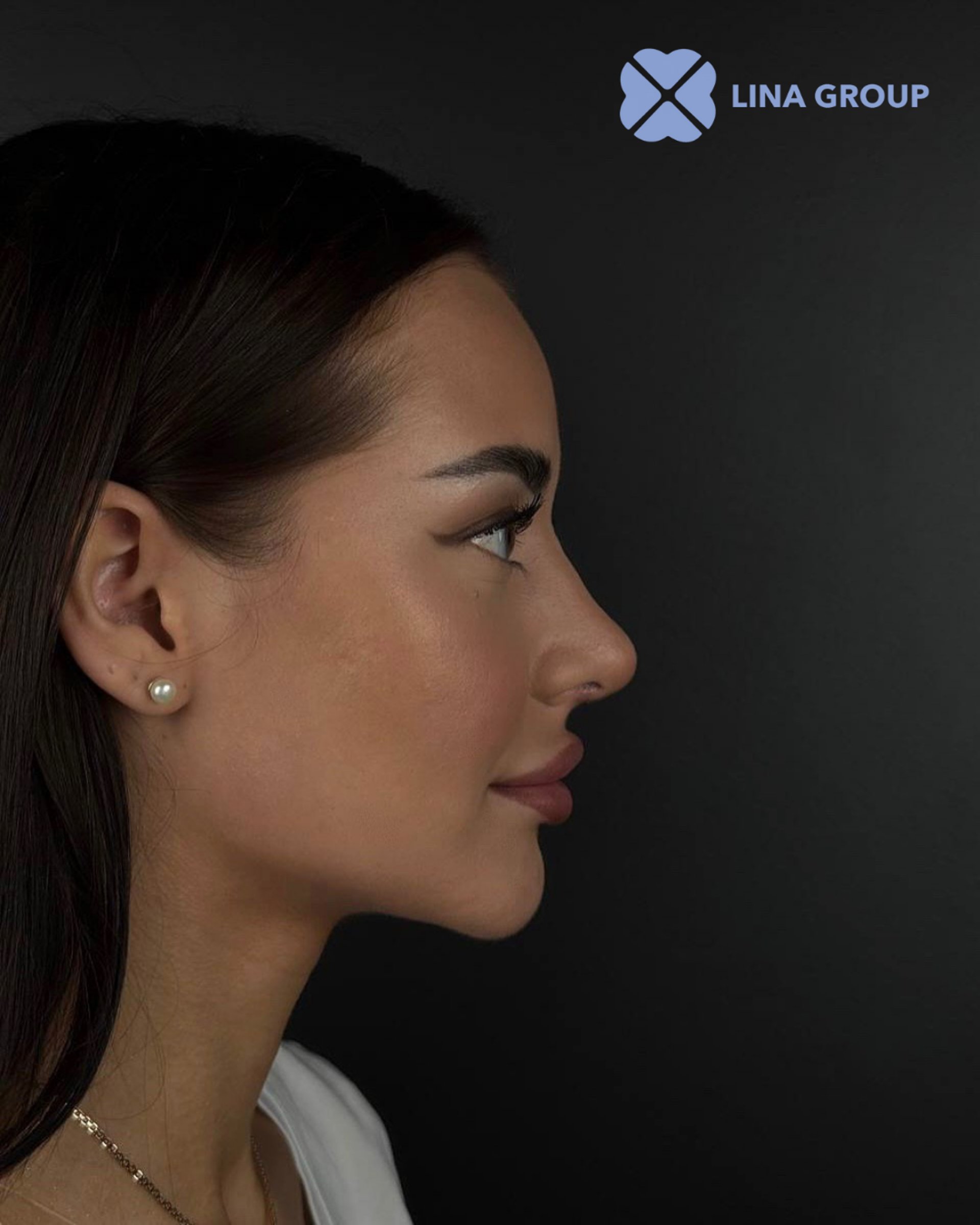 A group of doctors standing around a hospital bed