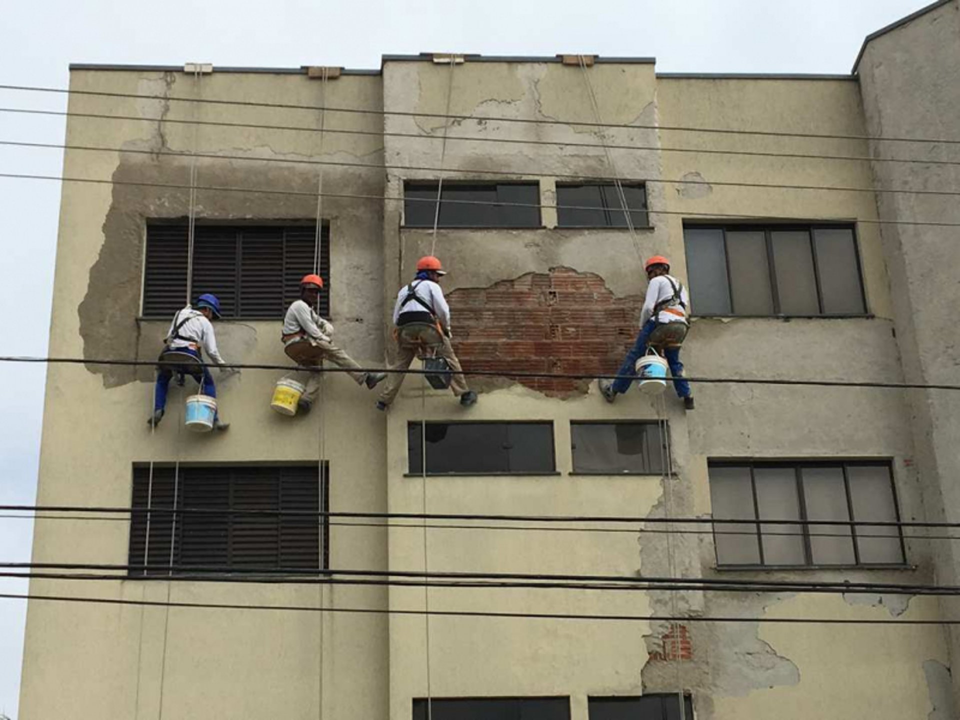 woman wearing yellow long-sleeved dress under white clouds and blue sky during daytime